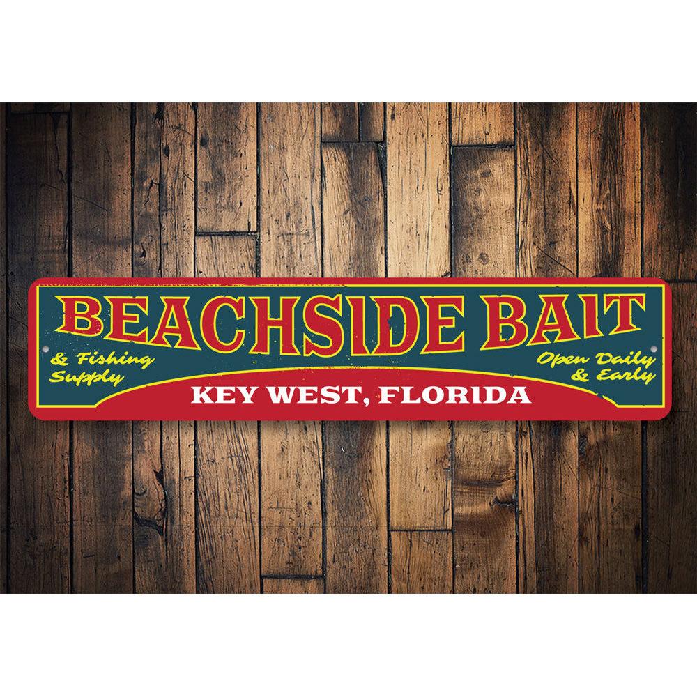 A decorative Beachside Bait Sign made of aluminum, featuring coastal-themed design elements, perfect for beach houses and restaurants.