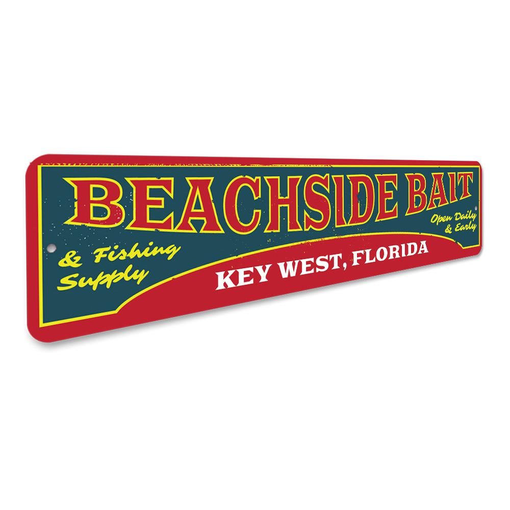 A decorative Beachside Bait Sign made of aluminum, featuring coastal-themed design elements, perfect for beach houses and restaurants.