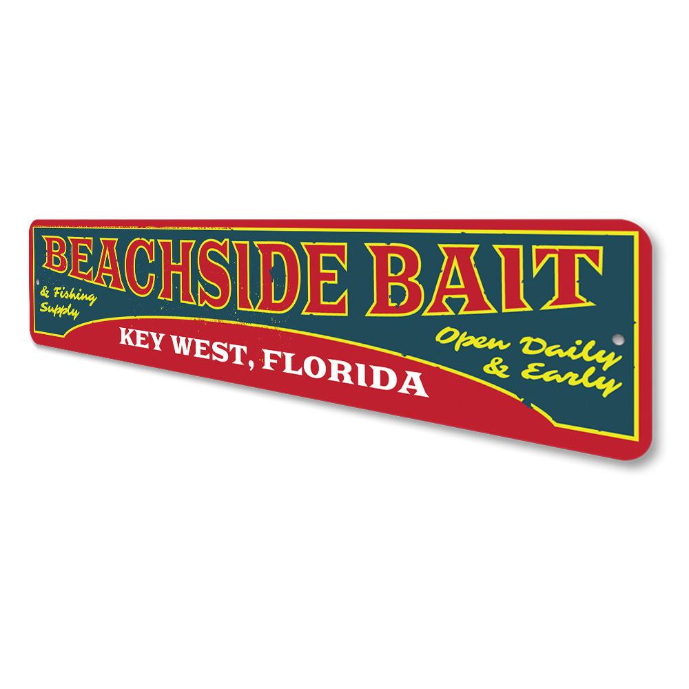 A decorative Beachside Bait Sign made of aluminum, featuring coastal-themed design elements, perfect for beach houses and restaurants.