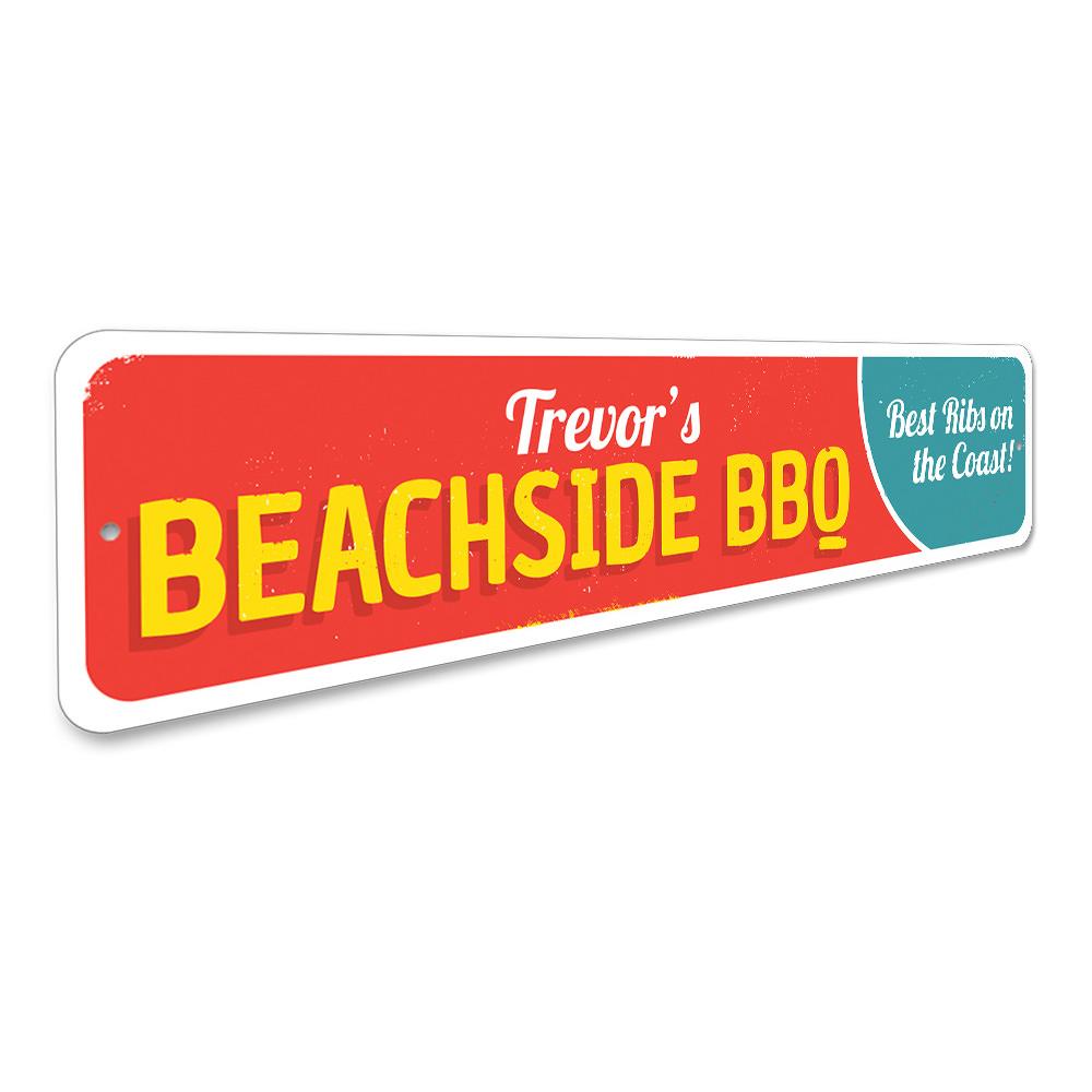 A vibrant Beachside BBQ Sign made of durable aluminum, featuring customizable text and pre-drilled holes for easy mounting, perfect for coastal decor.