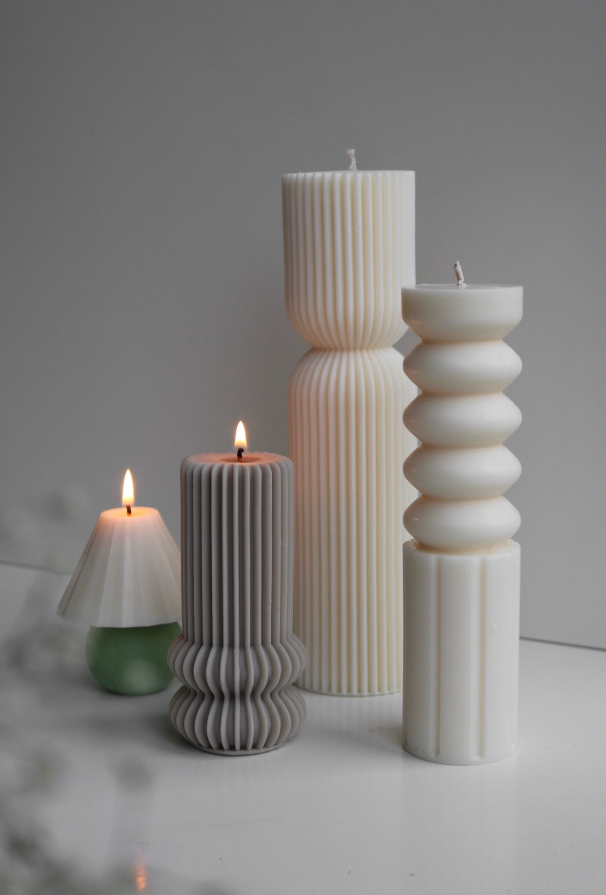 Elegant bead pillar candle made from soy wax blend, showcasing a sculptural design perfect for home decor.