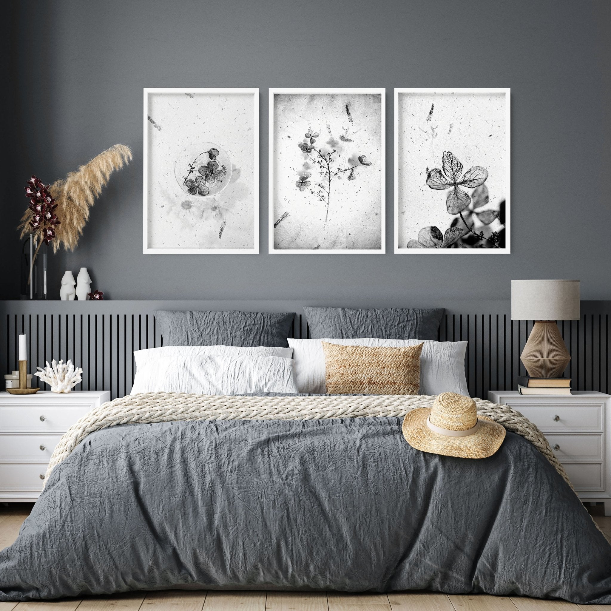 Set of 3 framed wall art prints featuring Greyscale Dry Floral Botanicals, elegantly displayed for bedroom decor.