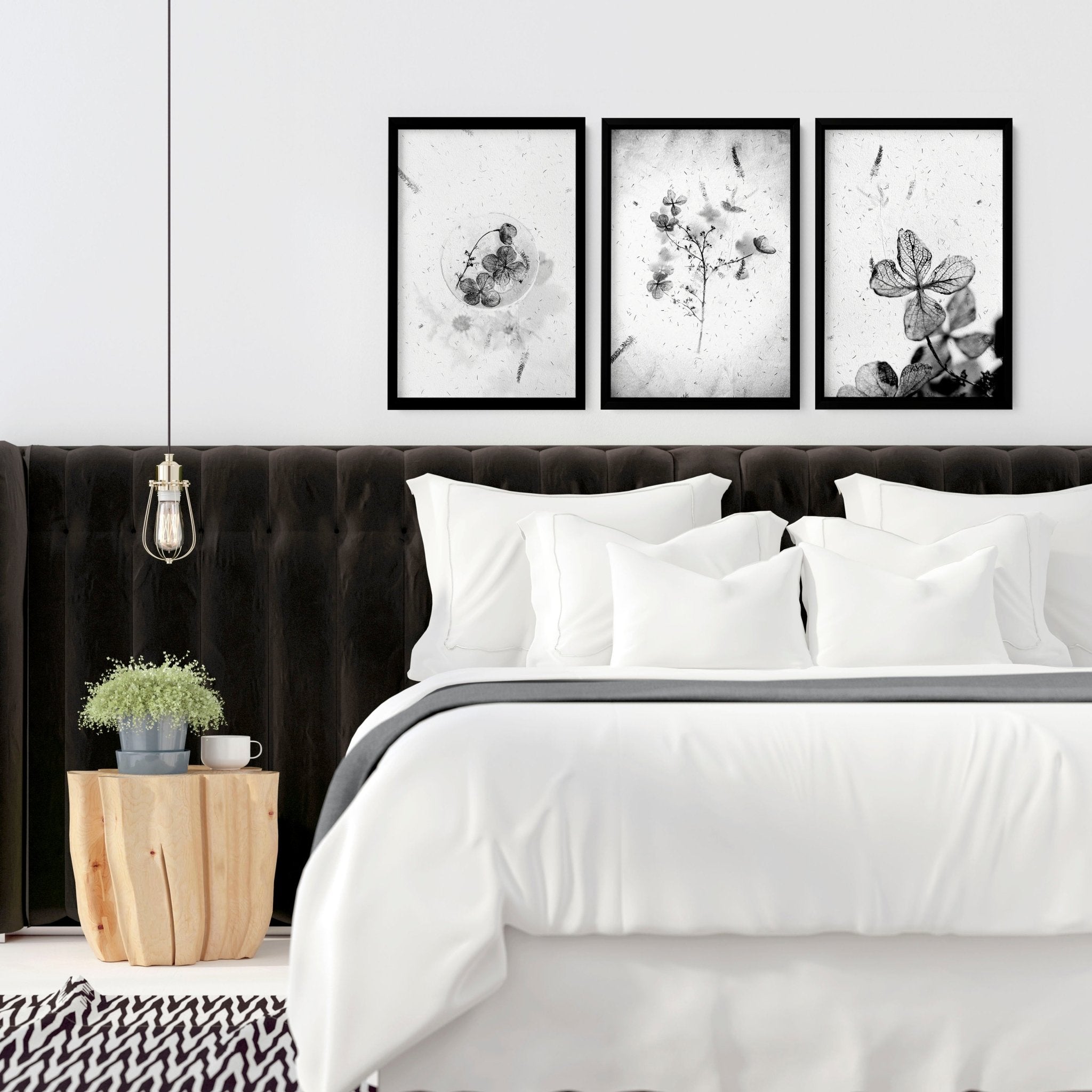 Set of 3 framed wall art prints featuring Greyscale Dry Floral Botanicals, elegantly displayed for bedroom decor.