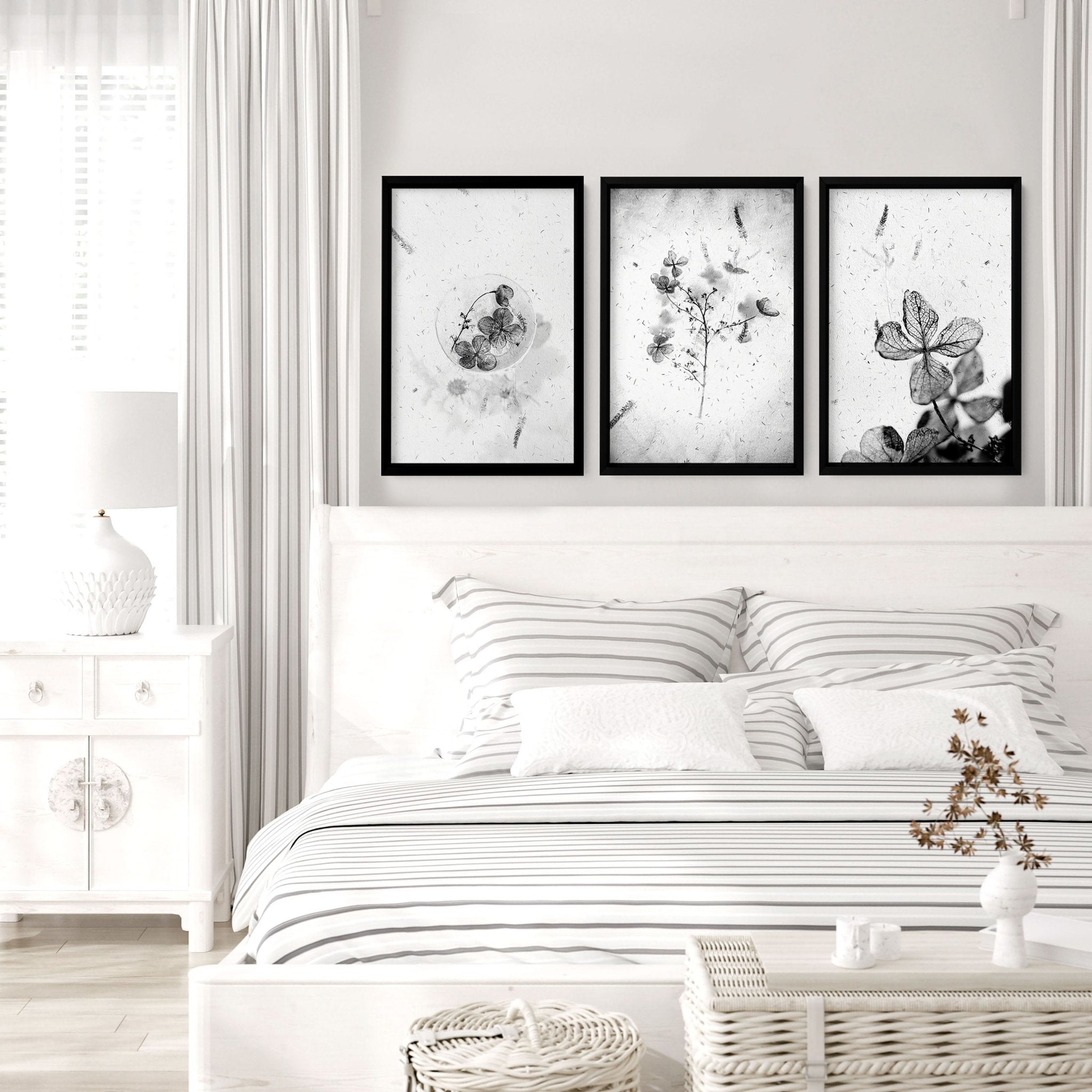 Set of 3 framed wall art prints featuring Greyscale Dry Floral Botanicals, elegantly displayed for bedroom decor.