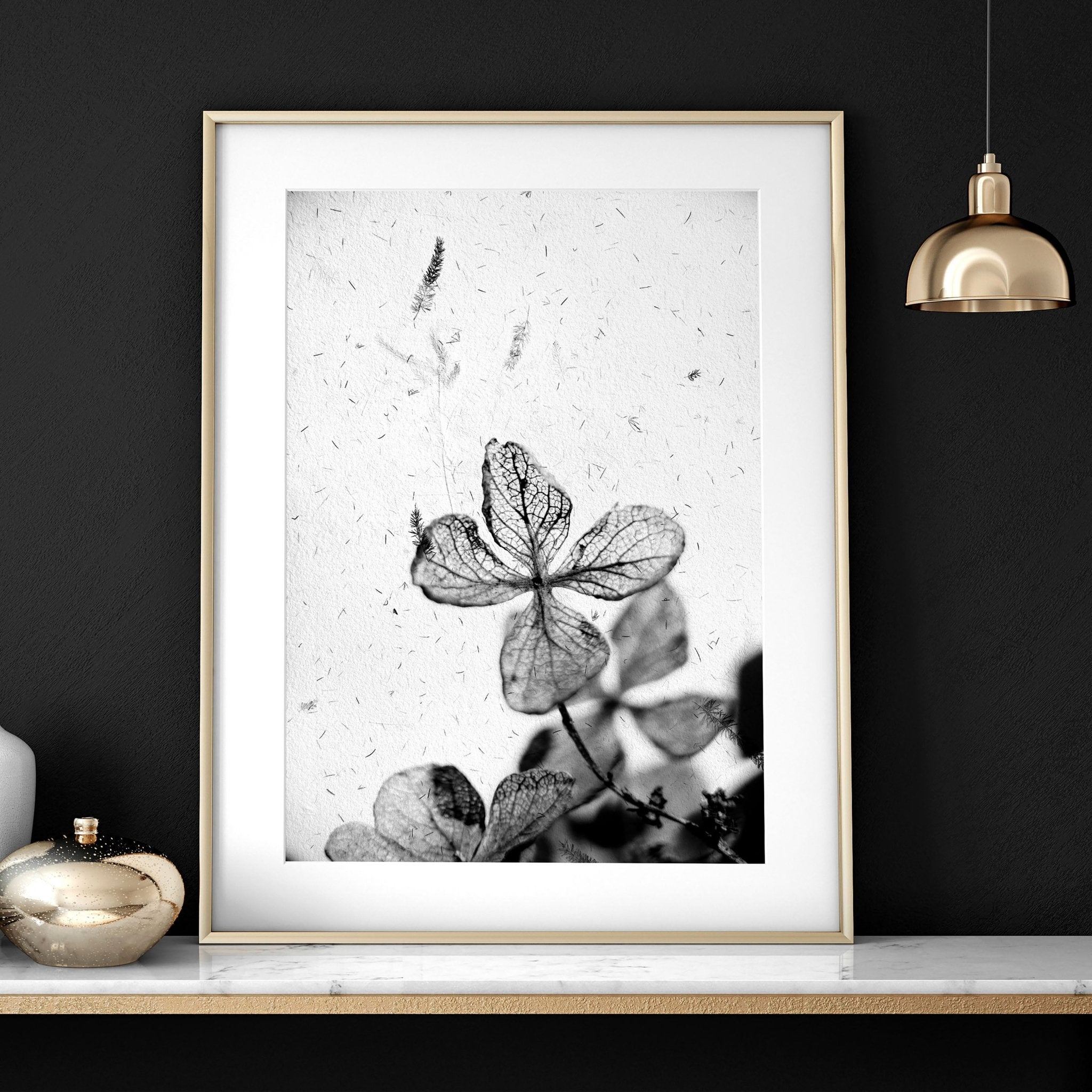 Set of 3 framed wall art prints featuring Greyscale Dry Floral Botanicals, elegantly displayed for bedroom decor.