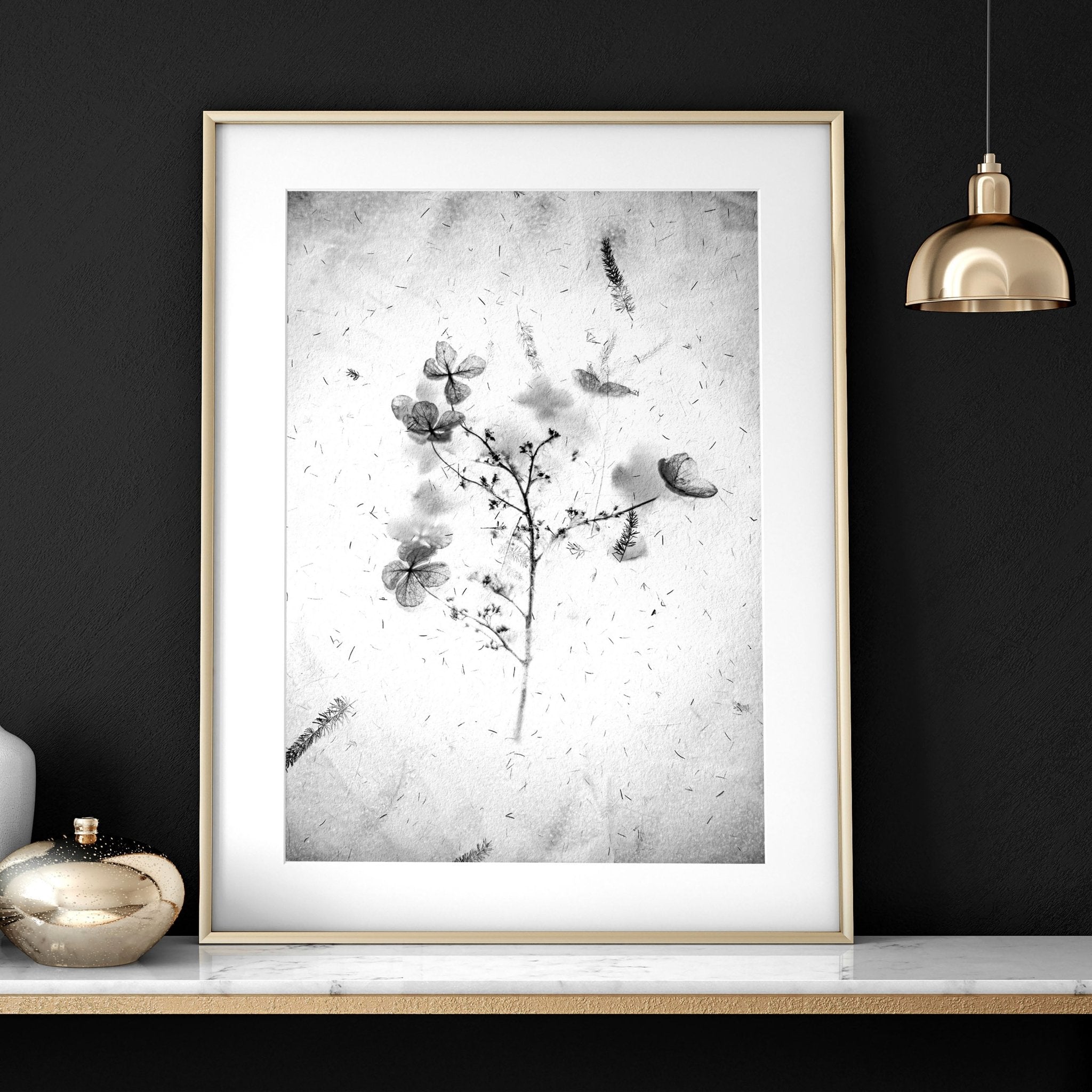 Set of 3 framed wall art prints featuring Greyscale Dry Floral Botanicals, elegantly displayed for bedroom decor.