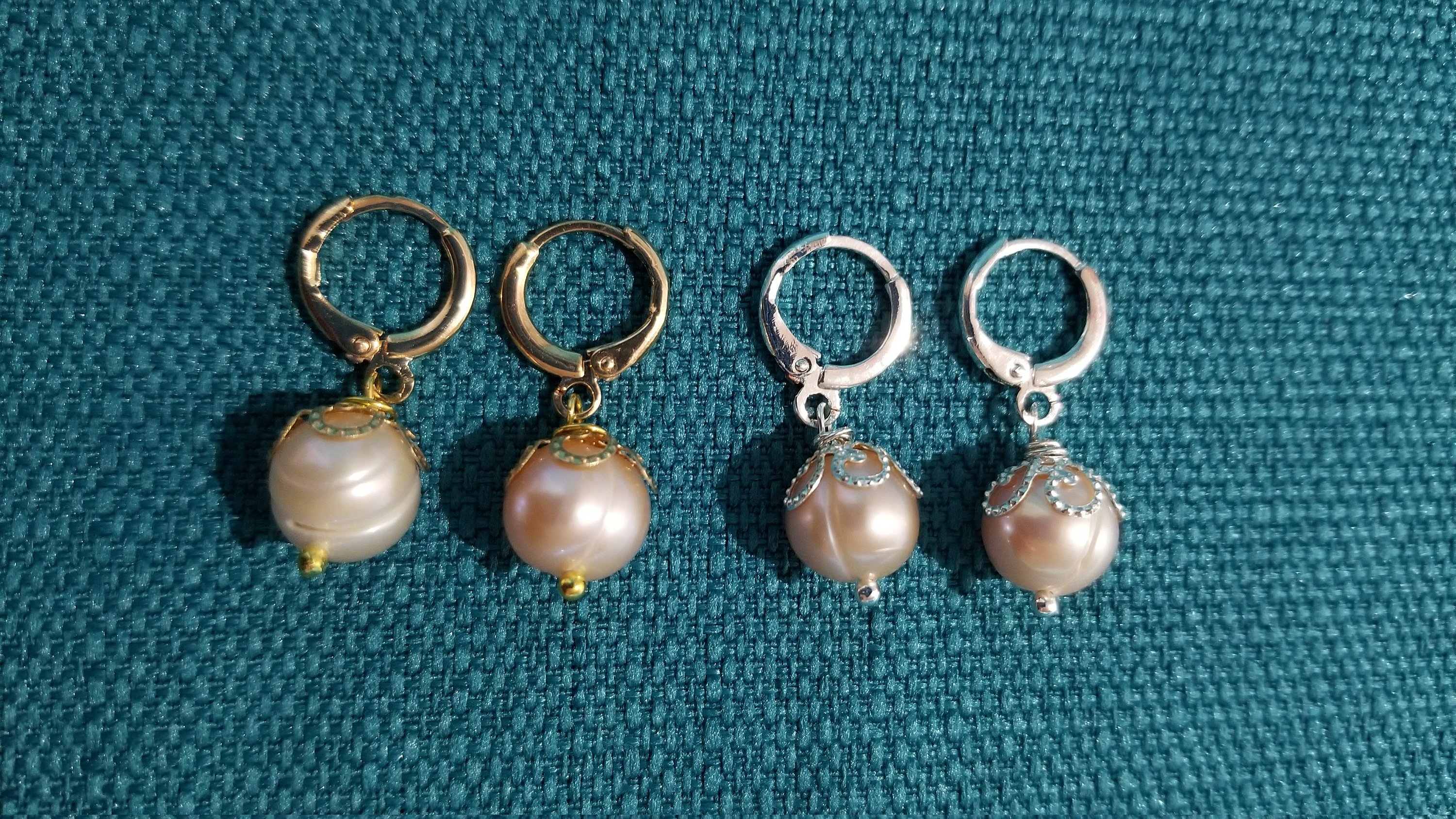 Elegant beige pearl hoop earrings with golden and silver options, showcasing a simple yet stylish design.