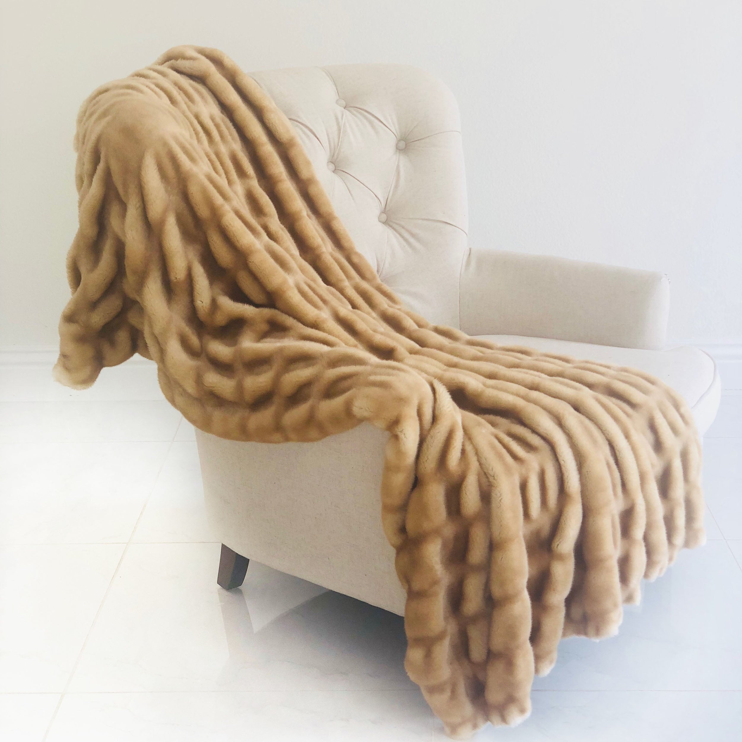 Beige Tissavel Mink Faux Fur Handmade Luxury Throw, showcasing its plush texture and elegant design, perfect for home décor.