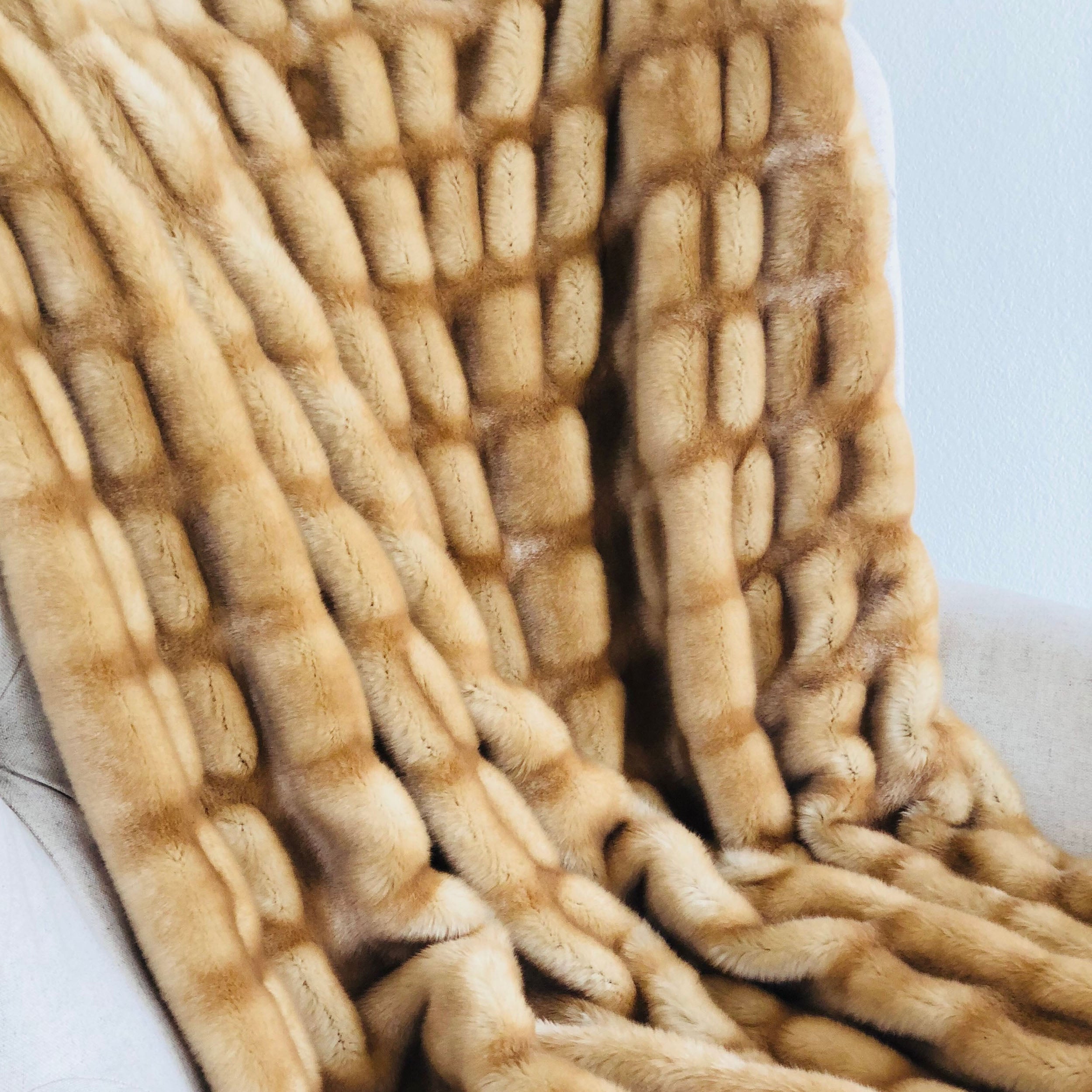 Beige Tissavel Mink Faux Fur Handmade Luxury Throw, showcasing its plush texture and elegant design, perfect for home décor.