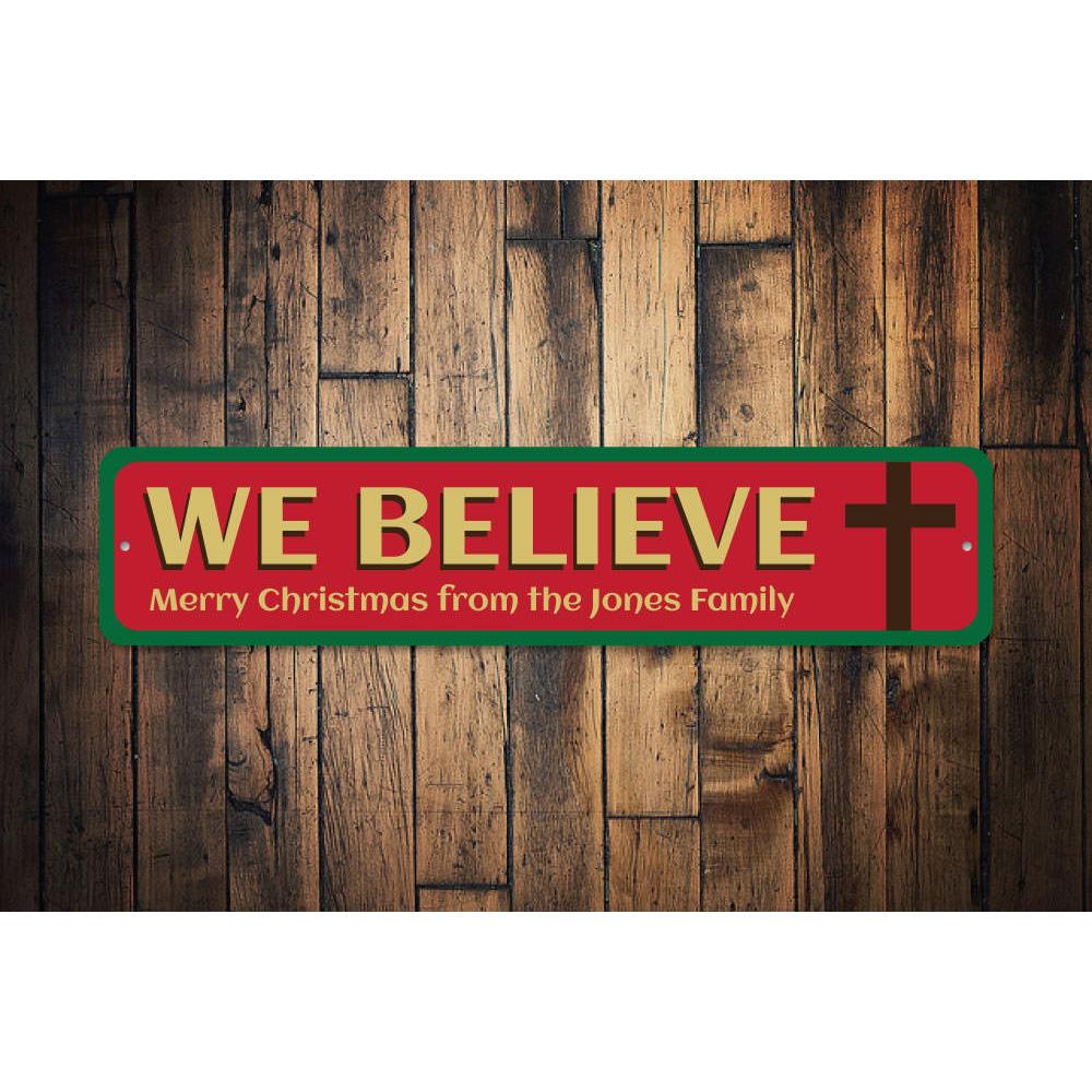 Believe Cross Sign featuring a festive design, made of high-quality aluminum, perfect for holiday decorations.