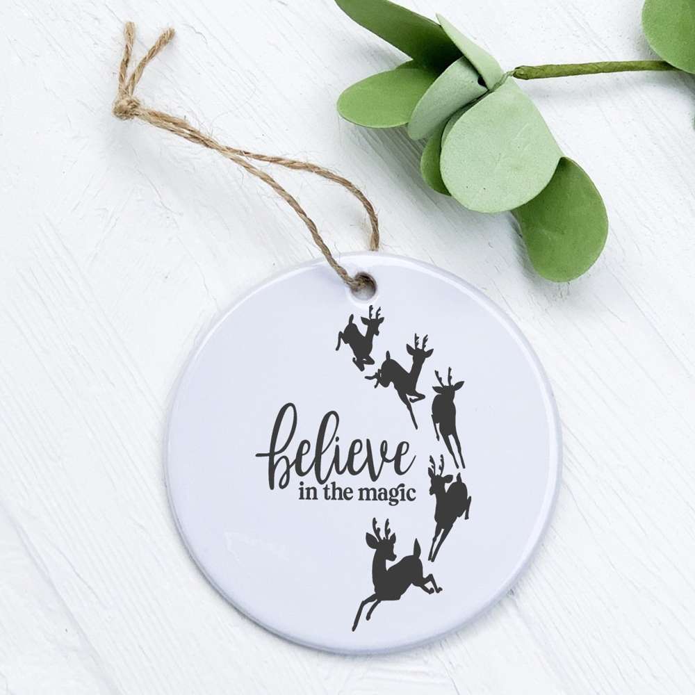 Believe in the Magic porcelain ornament featuring original design, 2.75 inches in diameter, with a smooth glossy finish.