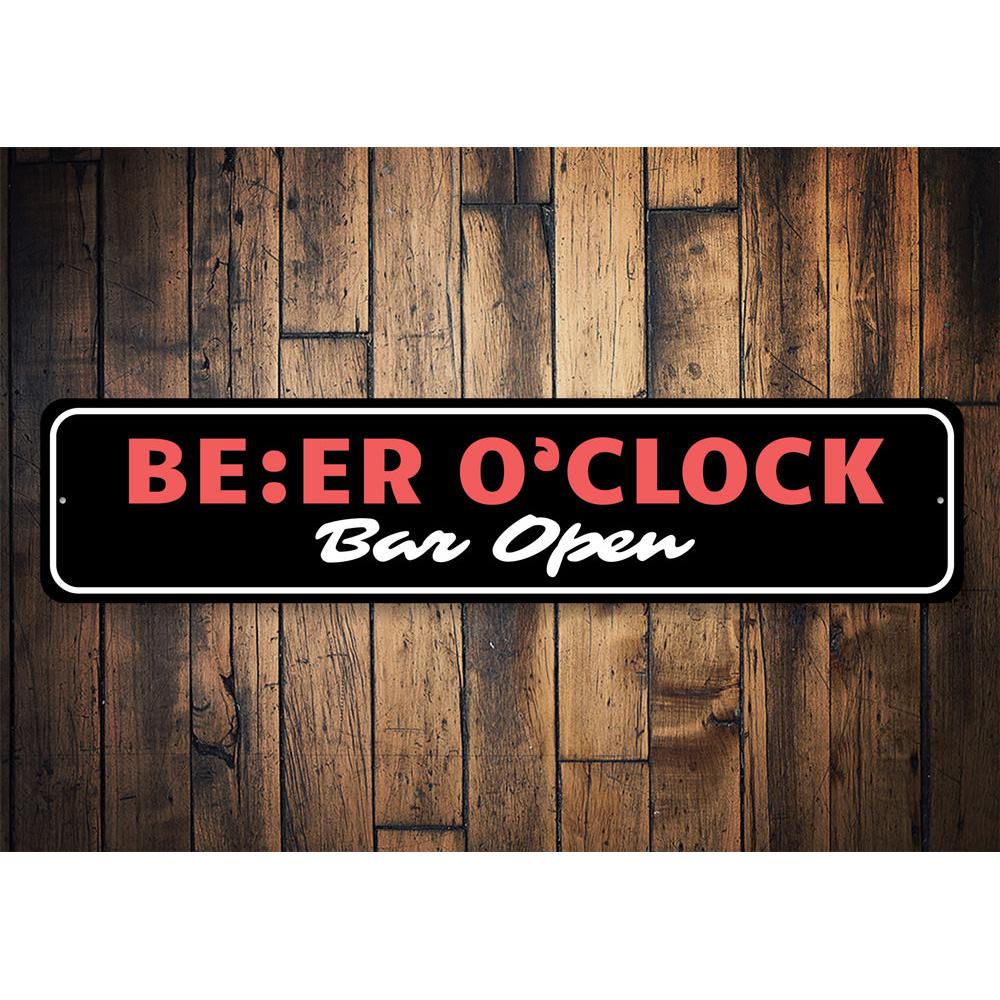 A decorative Beer O Clock Sign made of aluminum, featuring a fun design perfect for home bars or man caves.