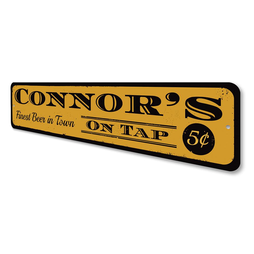 A decorative Beer On Tap Sign made of high-quality aluminum, featuring customizable text and pre-drilled holes for easy mounting.