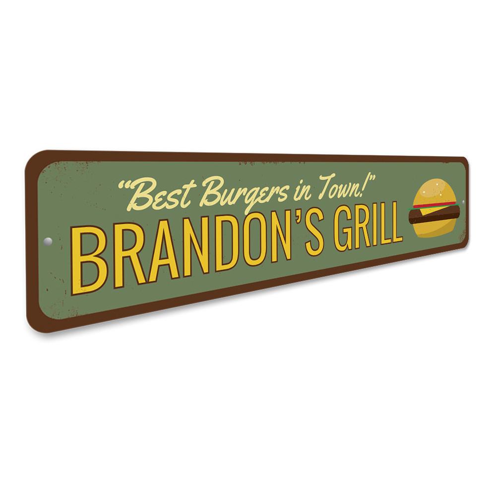 A decorative aluminum sign reading 'Best Burgers in Town', featuring vibrant colors and a stylish design, perfect for restaurants and cafes.