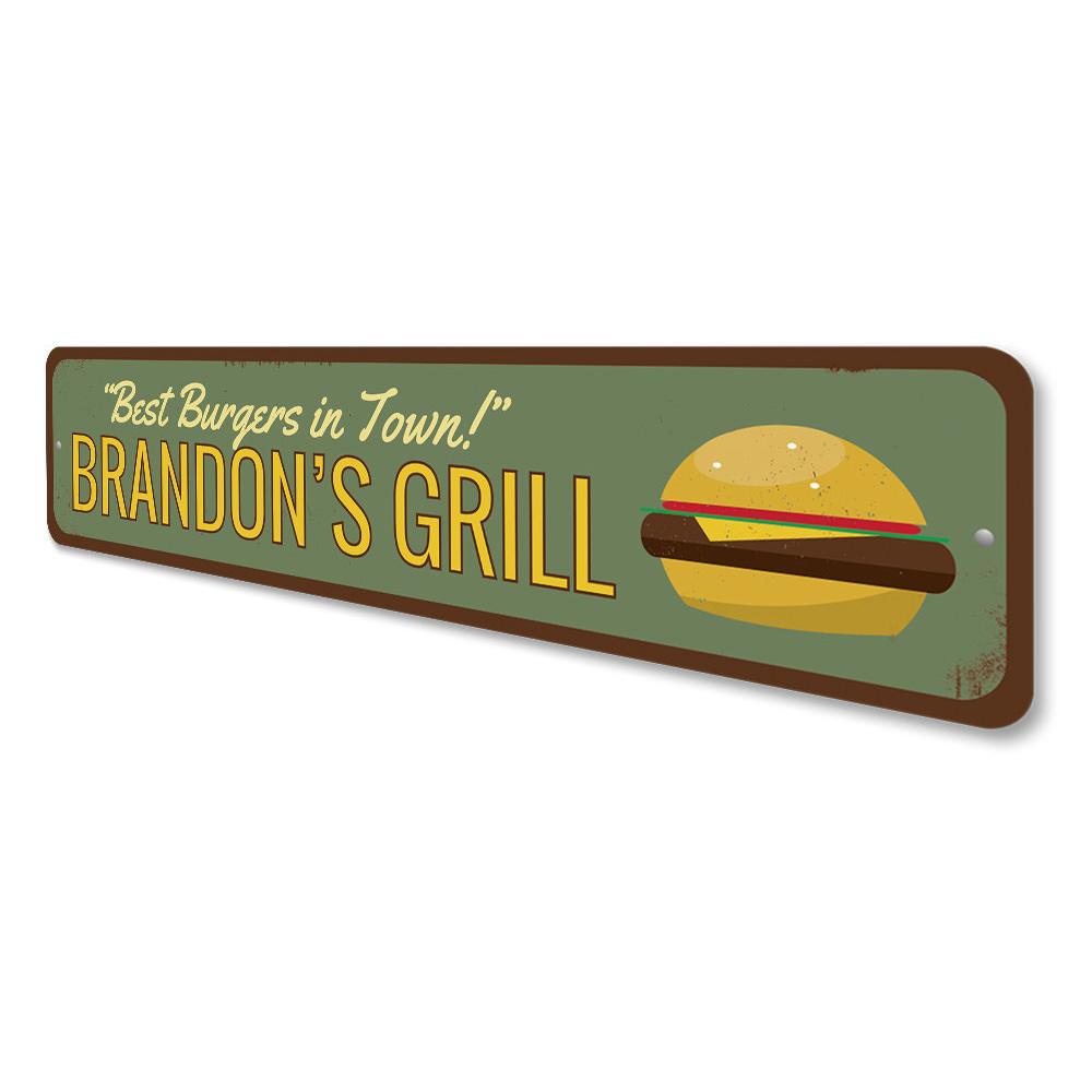 A decorative aluminum sign reading 'Best Burgers in Town', featuring vibrant colors and a stylish design, perfect for restaurants and cafes.