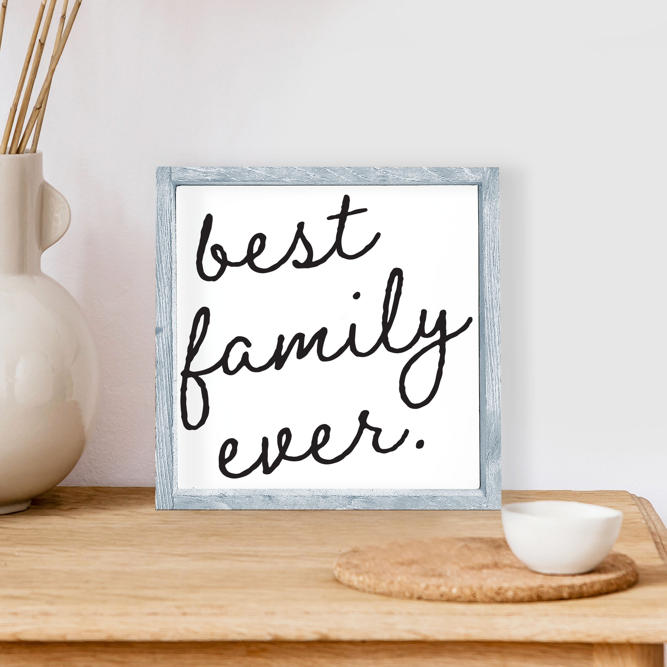 Best Family Ever Wood Sign with a rustic pine frame and waterproof black text on a white background, measuring 8x8 inches.