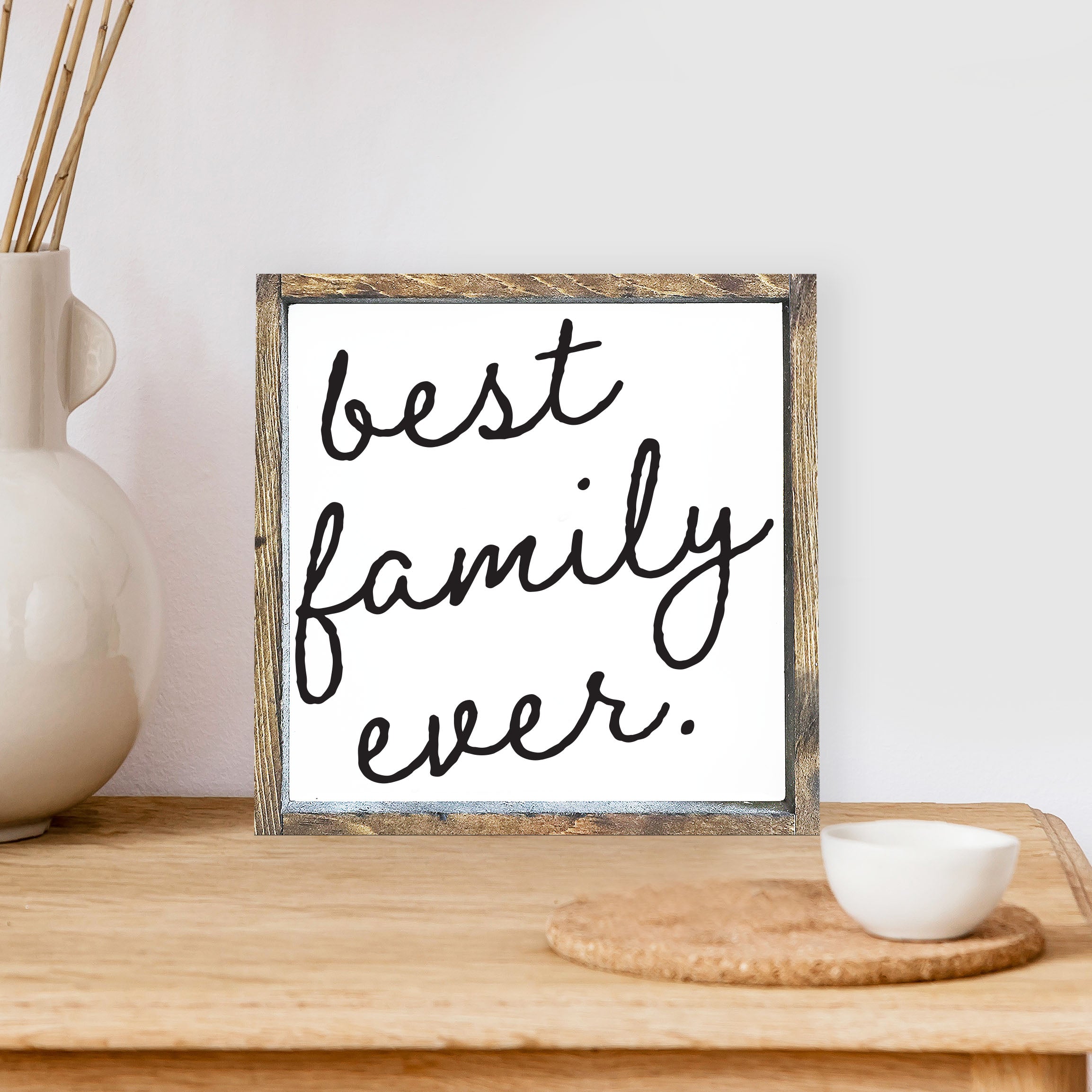 Best Family Ever Wood Sign with a rustic pine frame and waterproof black text on a white background, measuring 8x8 inches.