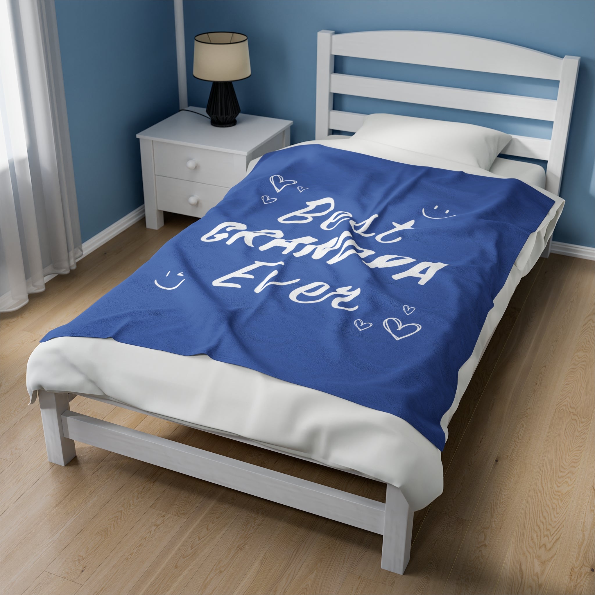 A cozy plush throw blanket featuring the phrase 'Best Grandpa Ever' in bold letters, perfect for gifting.