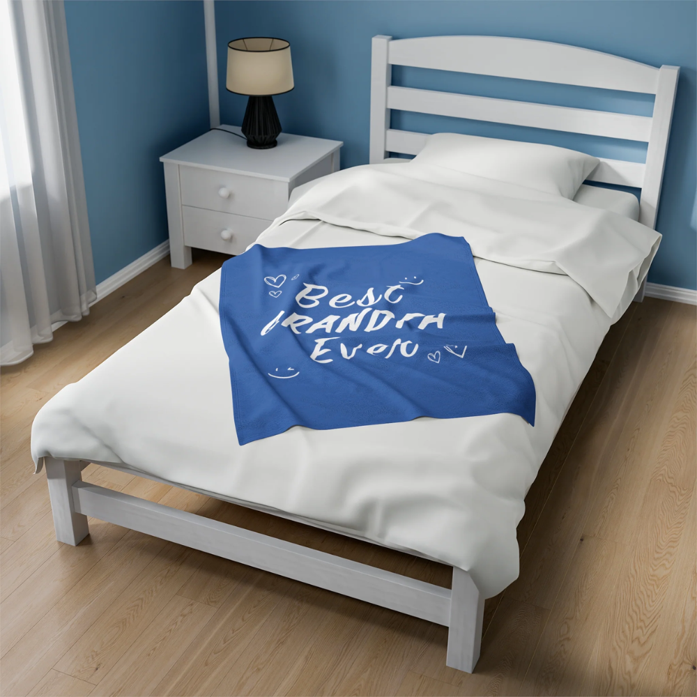 A cozy plush throw blanket featuring the phrase 'Best Grandpa Ever' in bold letters, perfect for gifting.