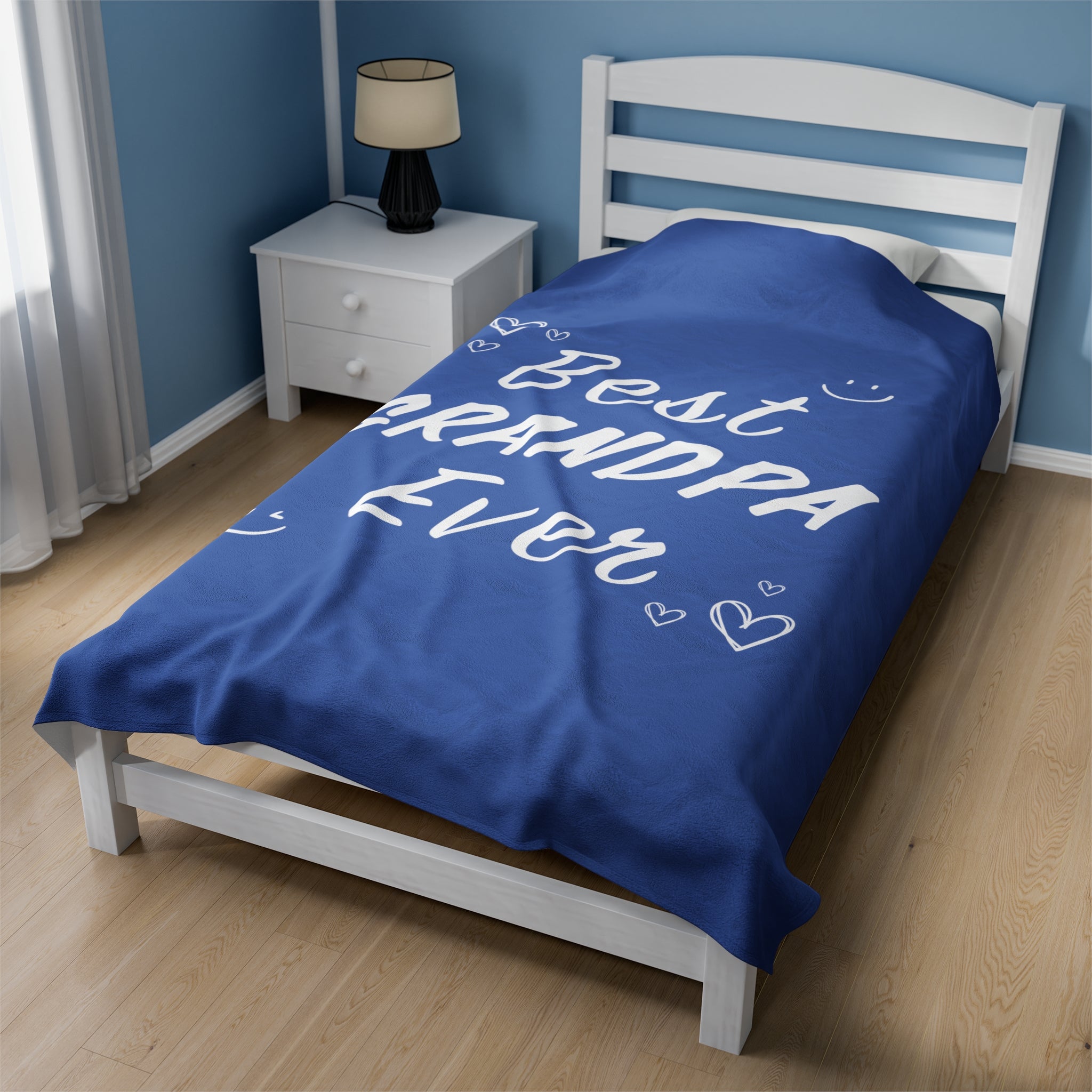 A cozy plush throw blanket featuring the phrase 'Best Grandpa Ever' in bold letters, perfect for gifting.