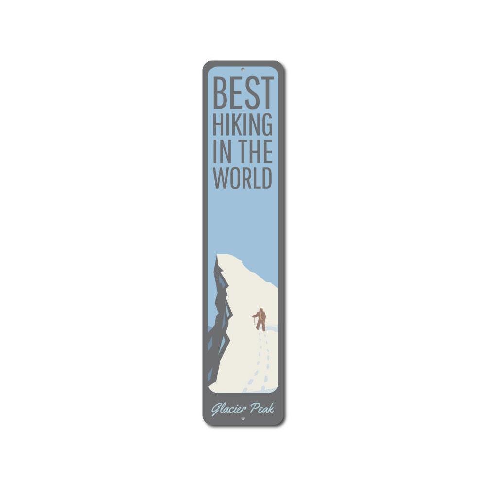 A decorative metal sign featuring the phrase 'Best Hiking in the World', showcasing a scenic mountain background, perfect for outdoor enthusiasts.