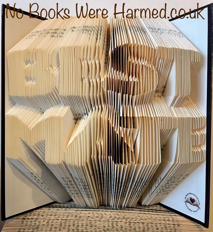 A beautifully crafted piece of book art titled BEST MATE, showcasing hand-folded pages from vintage books, with intricate designs and unique colors.