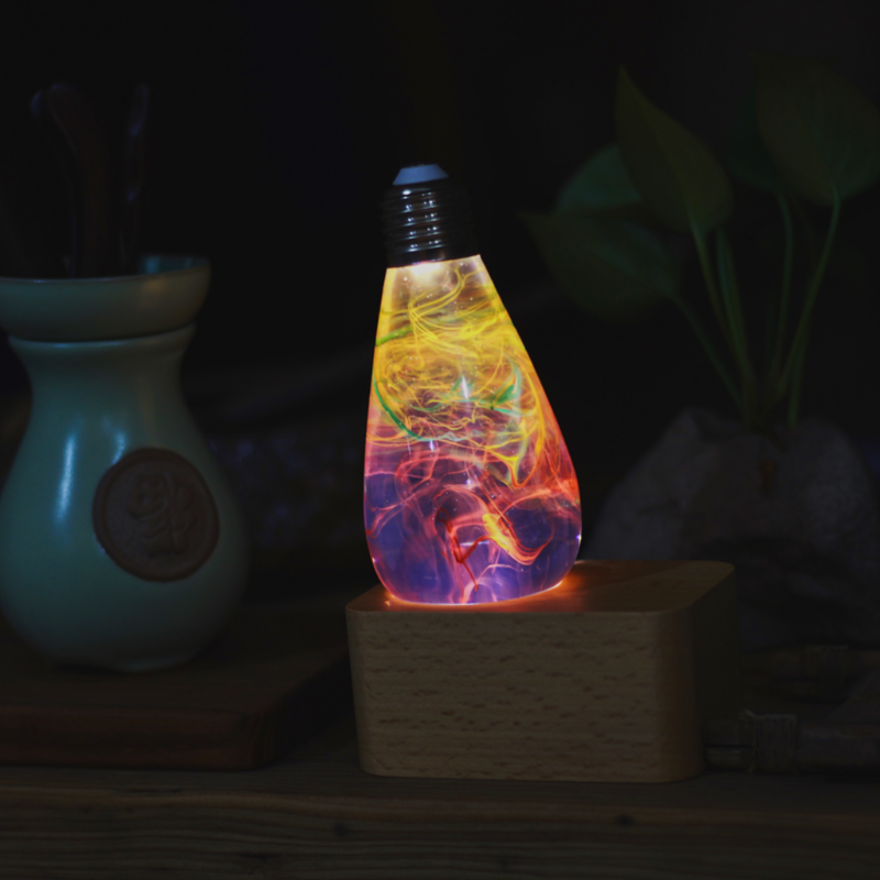 Best Seller Bundle featuring three eco-friendly LED bulbs in mixed colors, handcrafted with resin and beech wood.