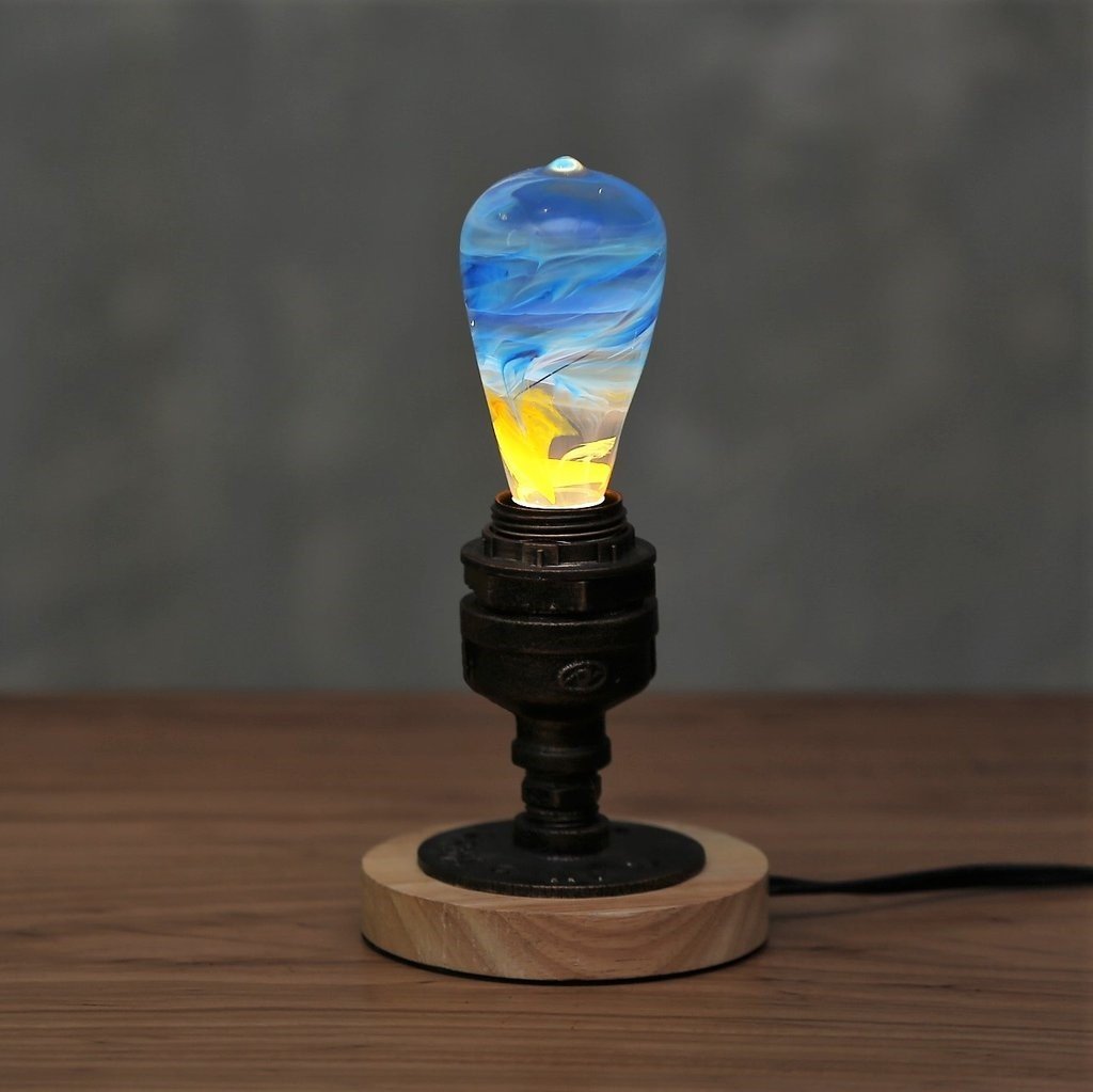 Best Seller Bundle featuring three eco-friendly LED bulbs in mixed colors, handcrafted with resin and beech wood.