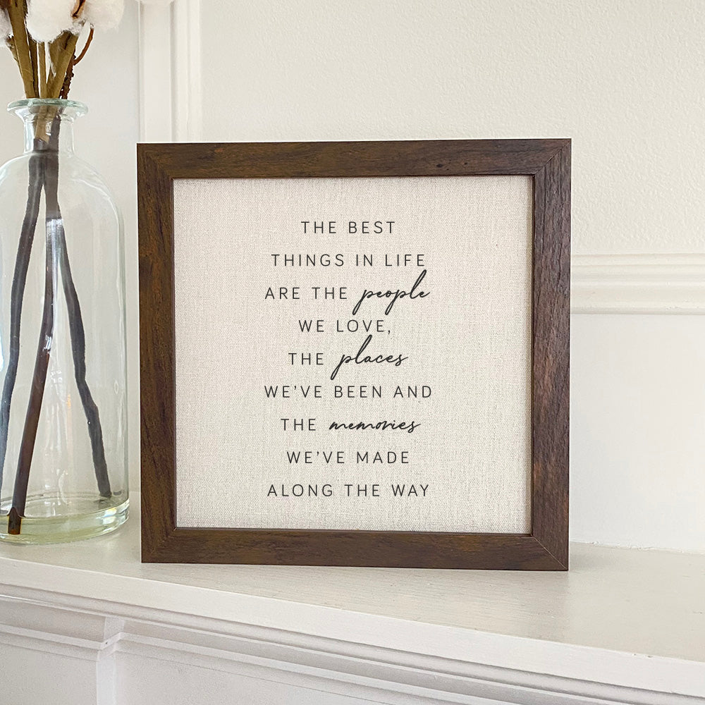 Framed sign featuring the phrase 'Best Things in Life' with a stylish wood frame, available in walnut or white-washed finish.