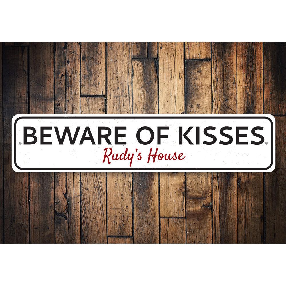 Beware of Kisses Sign made from high-quality aluminum, featuring playful text and pre-drilled holes for easy mounting.