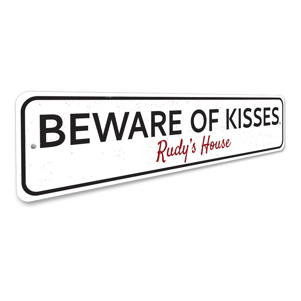 Beware of Kisses Sign made from high-quality aluminum, featuring playful text and pre-drilled holes for easy mounting.