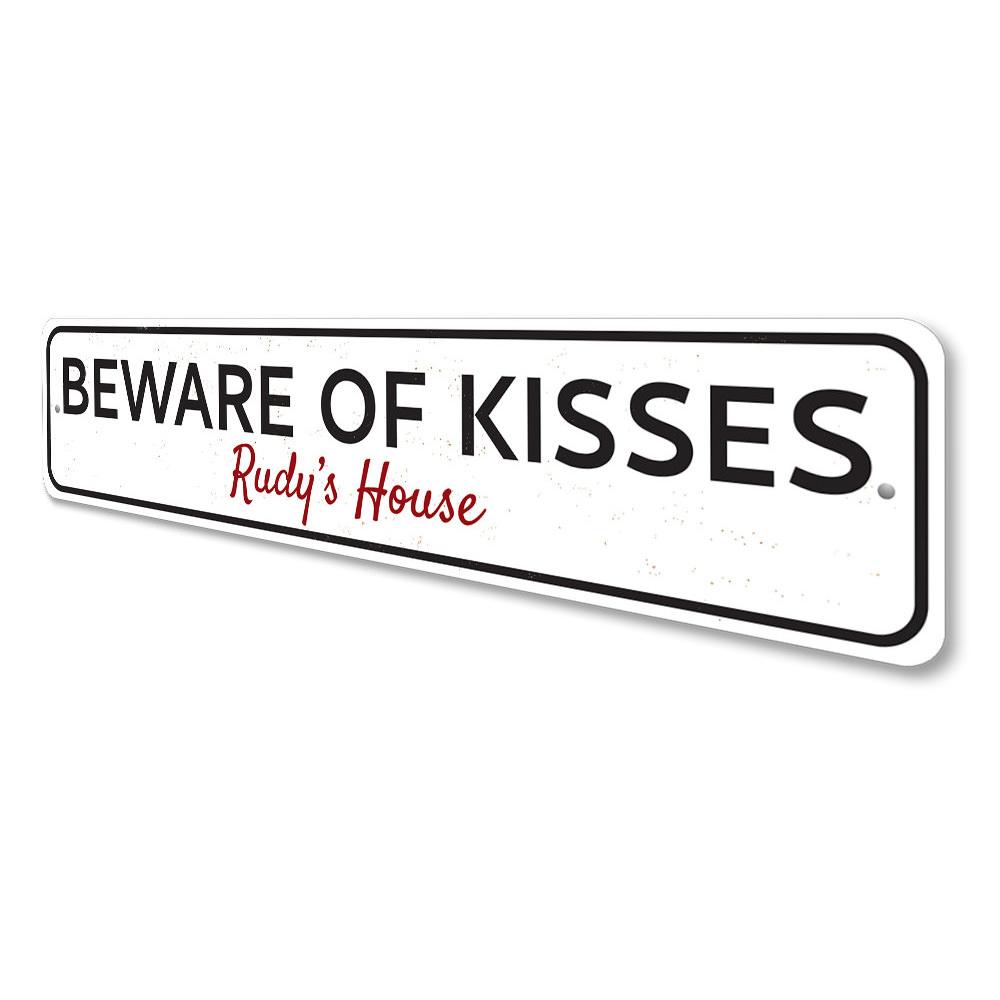 Beware of Kisses Sign made from high-quality aluminum, featuring playful text and pre-drilled holes for easy mounting.