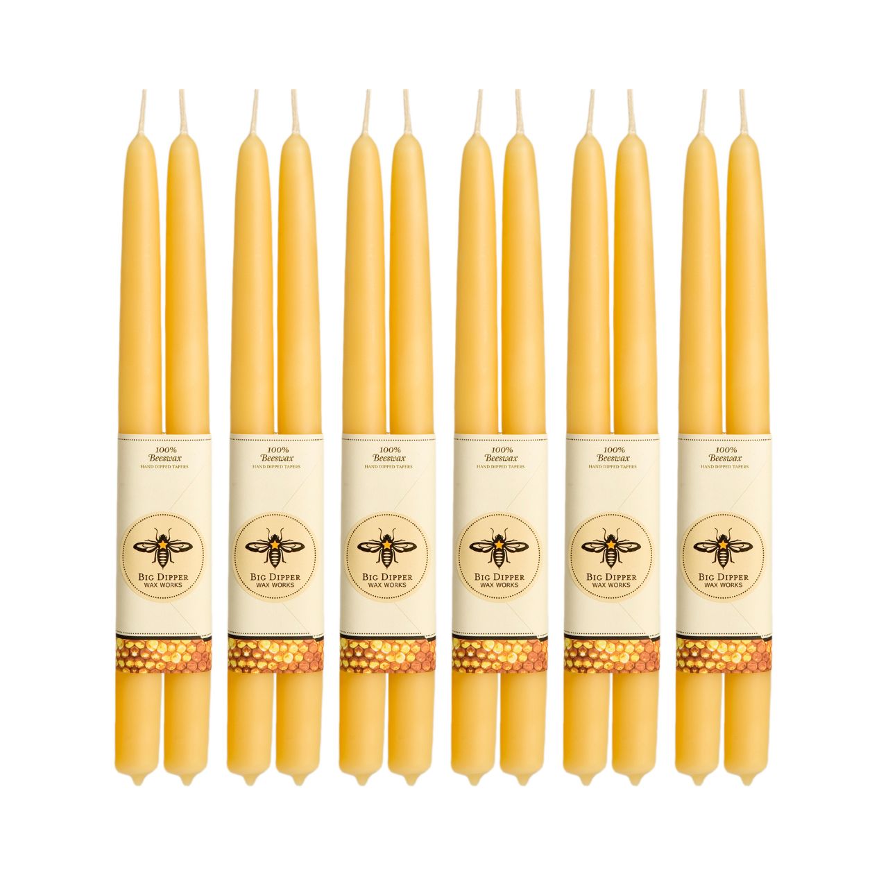 A pair of elegant Big Dipper Wax Works 100% Pure Beeswax STANDARD Tapers, hand-dipped and showcasing a warm golden hue.