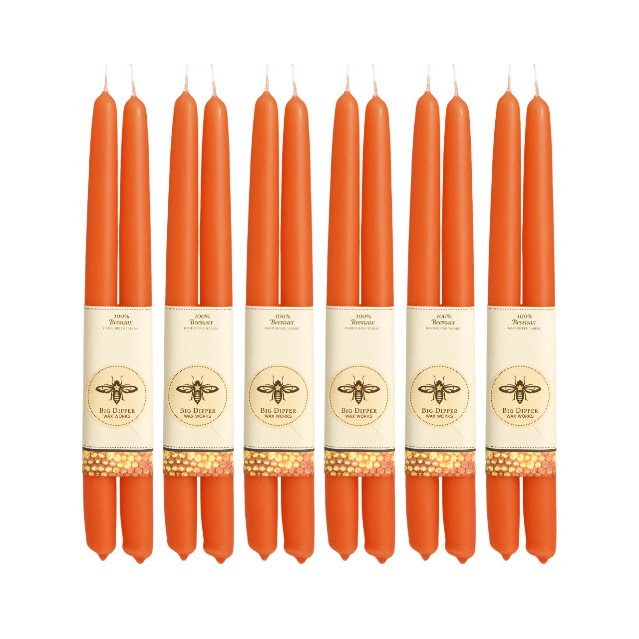 A pair of elegant Big Dipper Wax Works 100% Pure Beeswax STANDARD Tapers, hand-dipped and showcasing a warm golden hue.