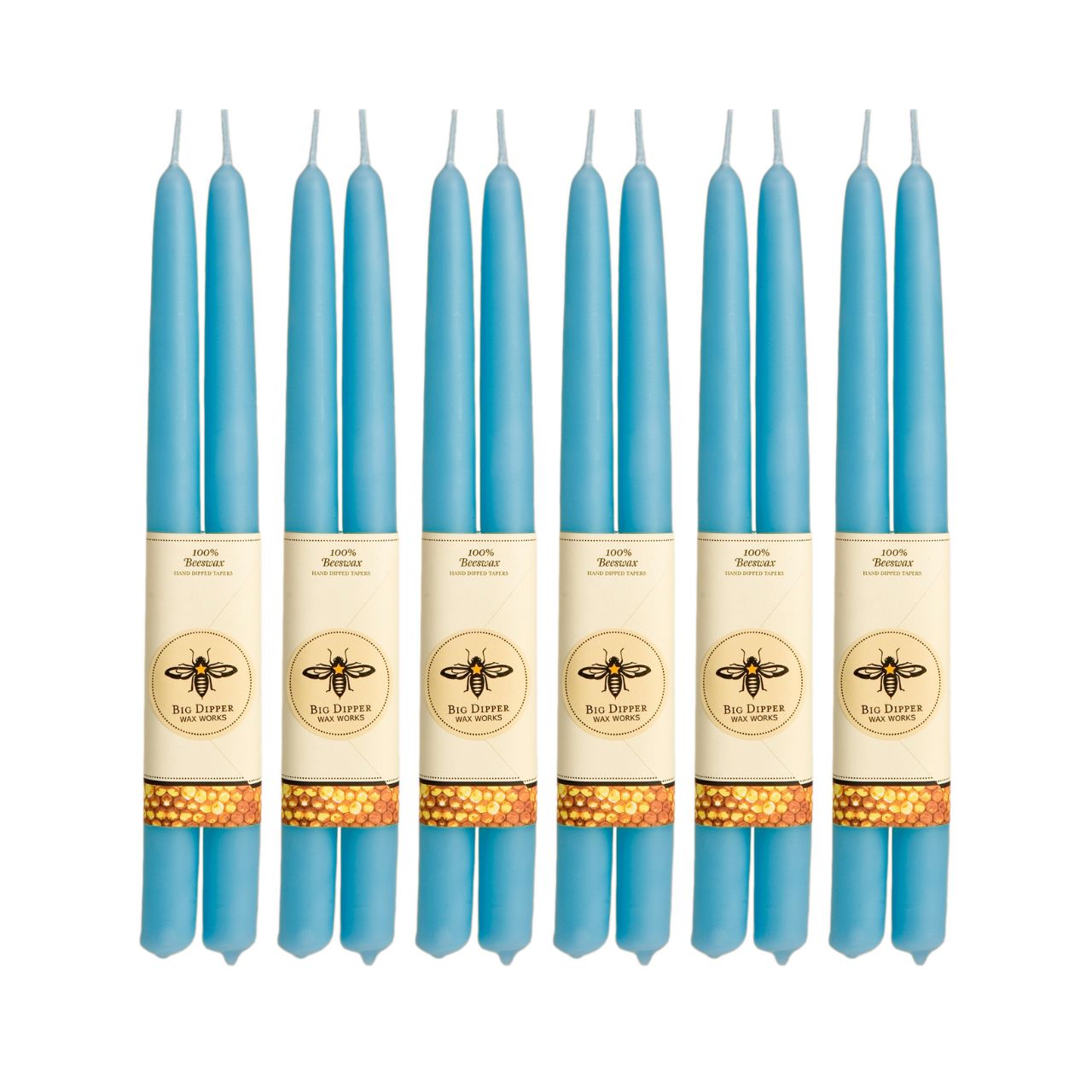 A pair of elegant Big Dipper Wax Works 100% Pure Beeswax STANDARD Tapers, hand-dipped and showcasing a warm golden hue.