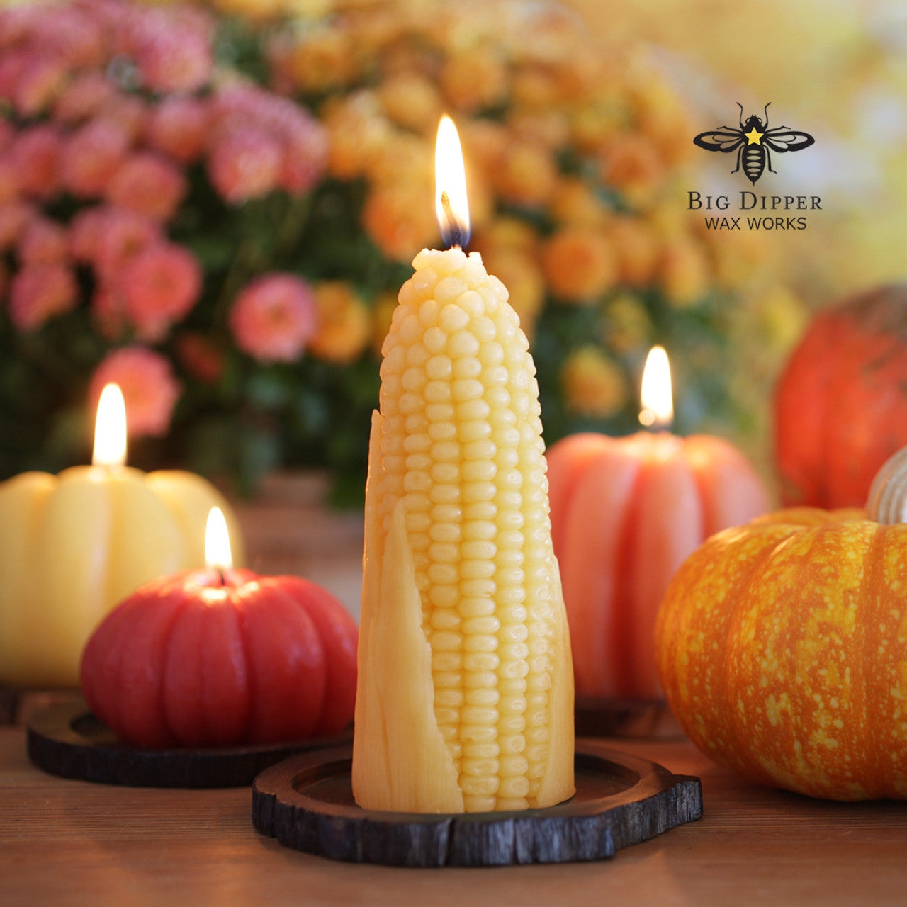 A hand-carved beeswax candle shaped like a corn cob, showcasing intricate details and a warm, natural color.