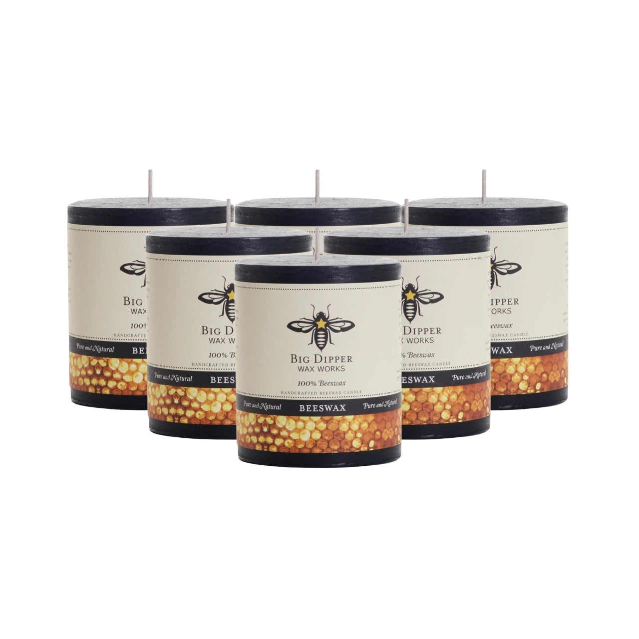 Big Dipper Wax Works Pure Beeswax Pillars in various sizes and colors, showcasing their elegant design and natural honey fragrance.