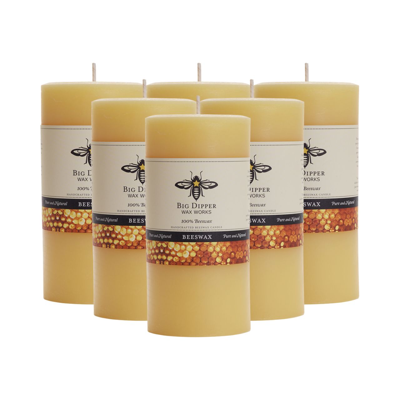 Big Dipper Wax Works Pure Beeswax Pillars in various sizes and colors, showcasing their elegant design and natural honey fragrance.