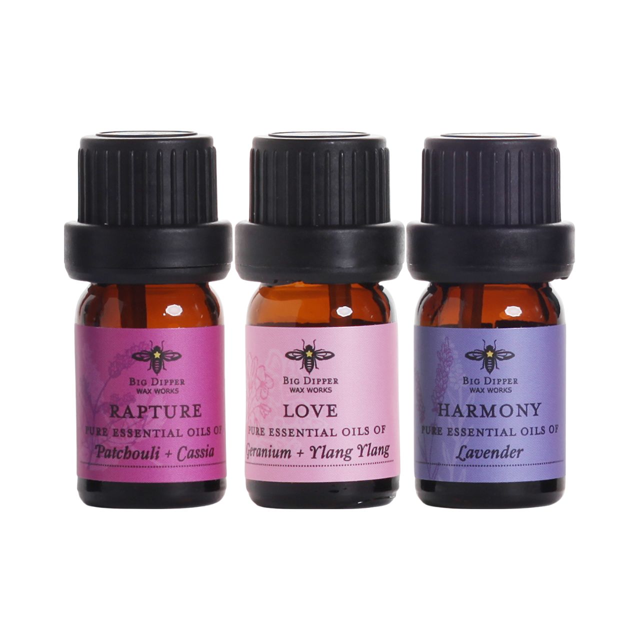 Big Dipper Wax Works essential oil blends in amber glass bottles, showcasing Rapture, Harmony, and Love scents for mood enhancement.