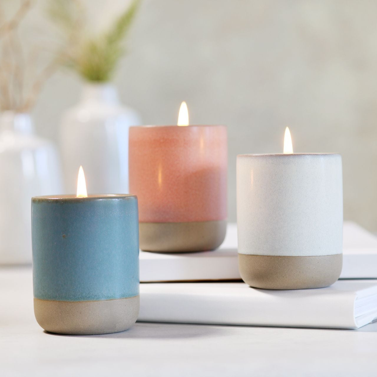 Big Dipper Wax Works Tranquility Stoneware Collection featuring three handcrafted vessels in muted colors with essential oils.