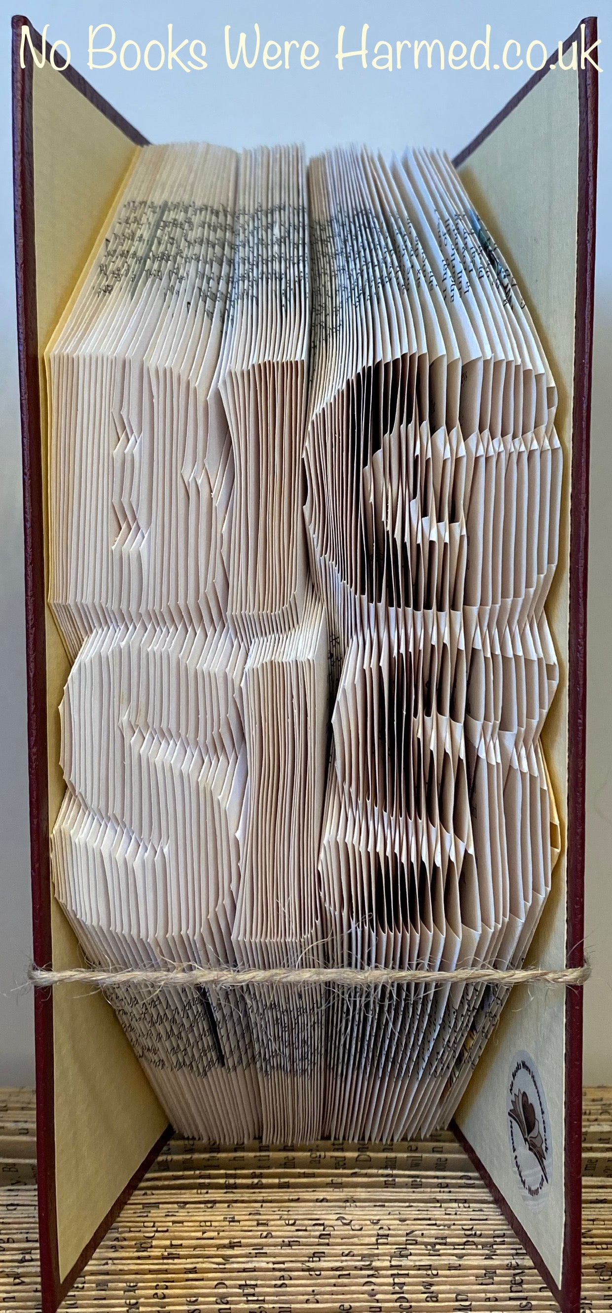 Handcrafted Big Sis book art made from vintage books, showcasing intricate hand-folded pages in a unique design.