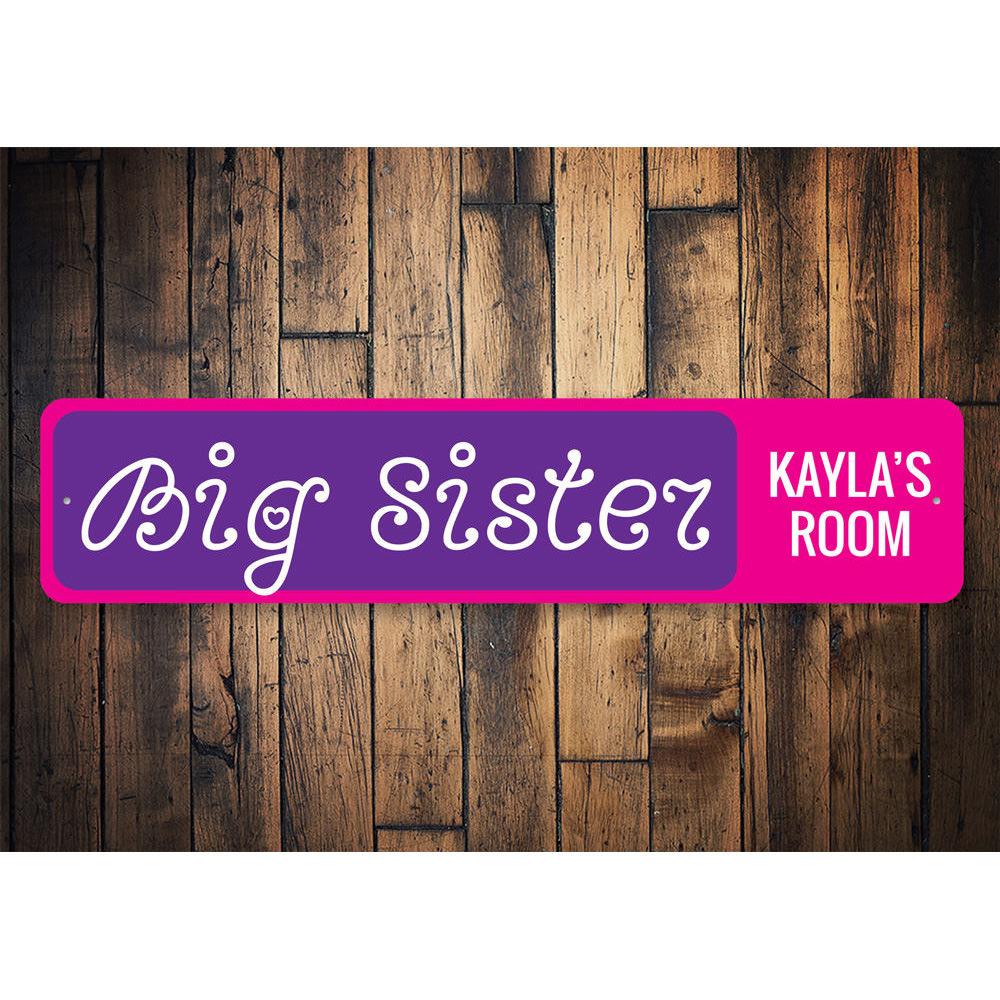 Big Sisters Room Sign made of durable aluminum, featuring customizable text for a personalized touch in a child's room.