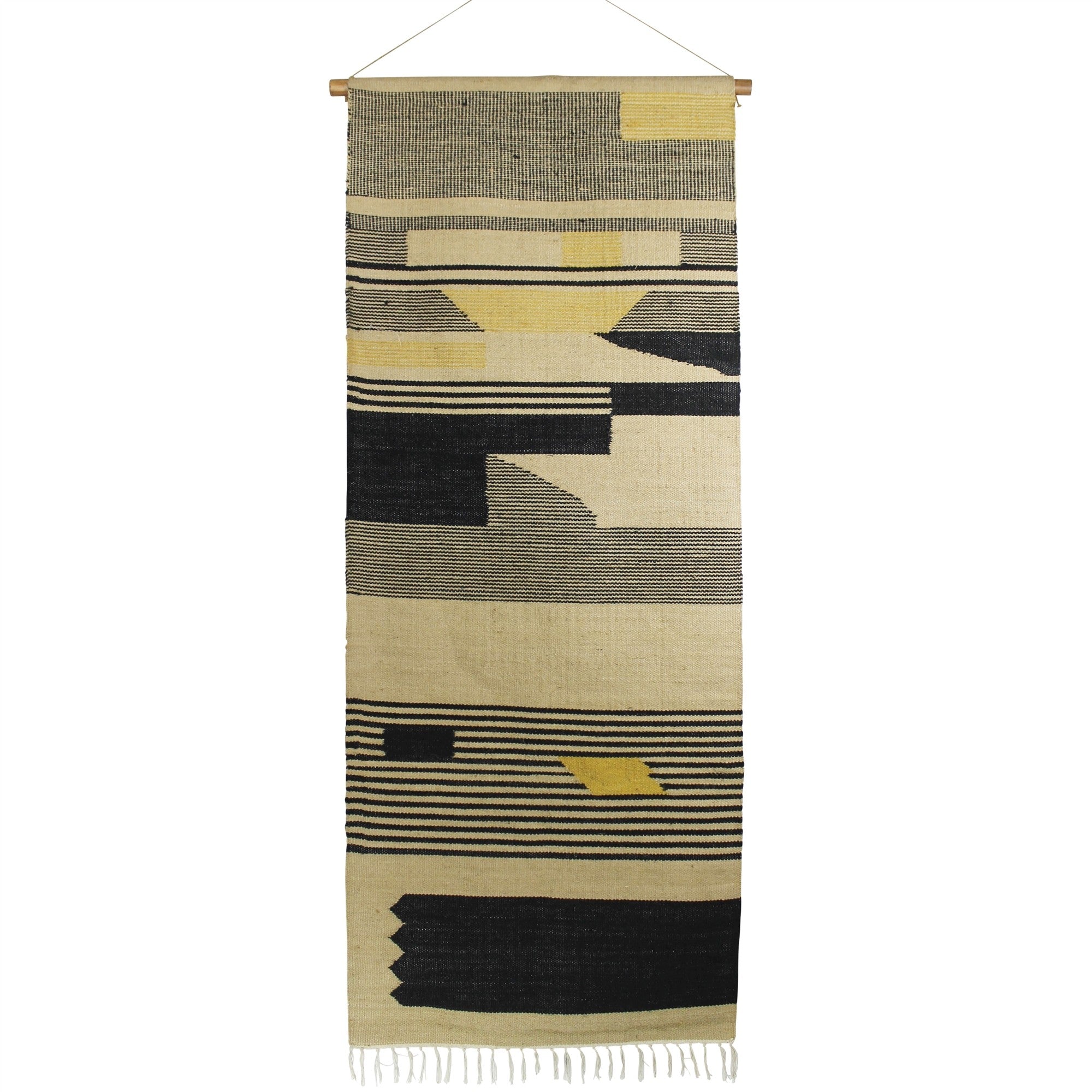 Black and beige wall hanging featuring angular patterns, handwoven from jute, adding texture and style to home decor.