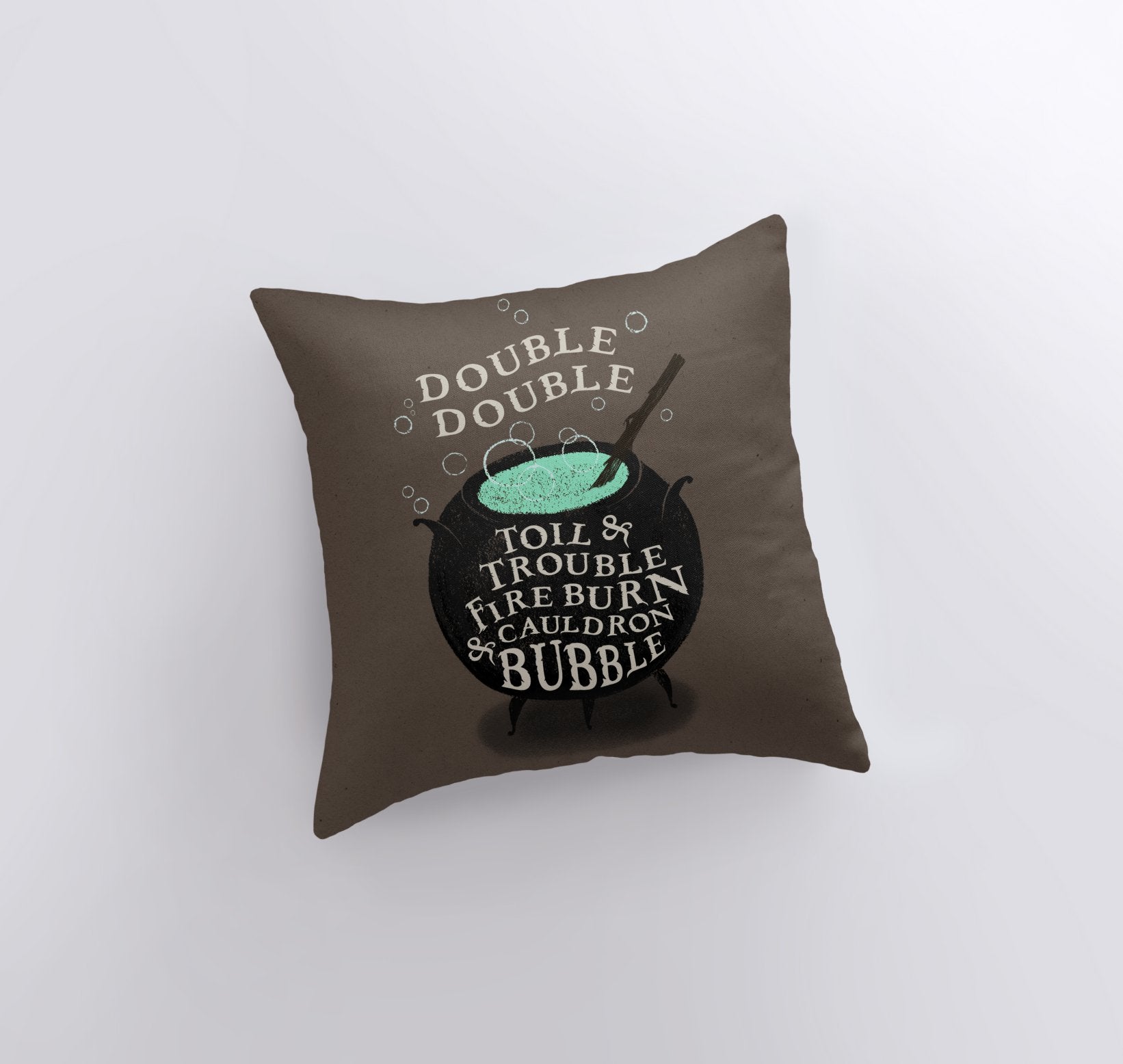 Black Cauldron Boiling Pillow Cover featuring a spooky cauldron design on a taupe background with Halloween-themed text.