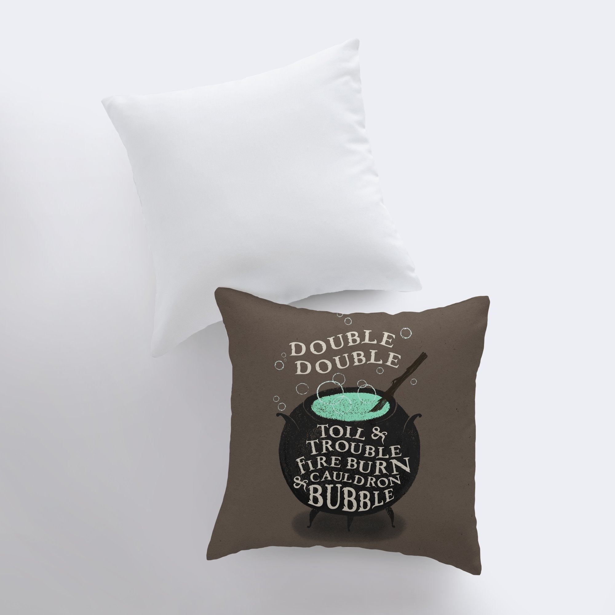 Black Cauldron Boiling Pillow Cover featuring a spooky cauldron design on a taupe background with Halloween-themed text.