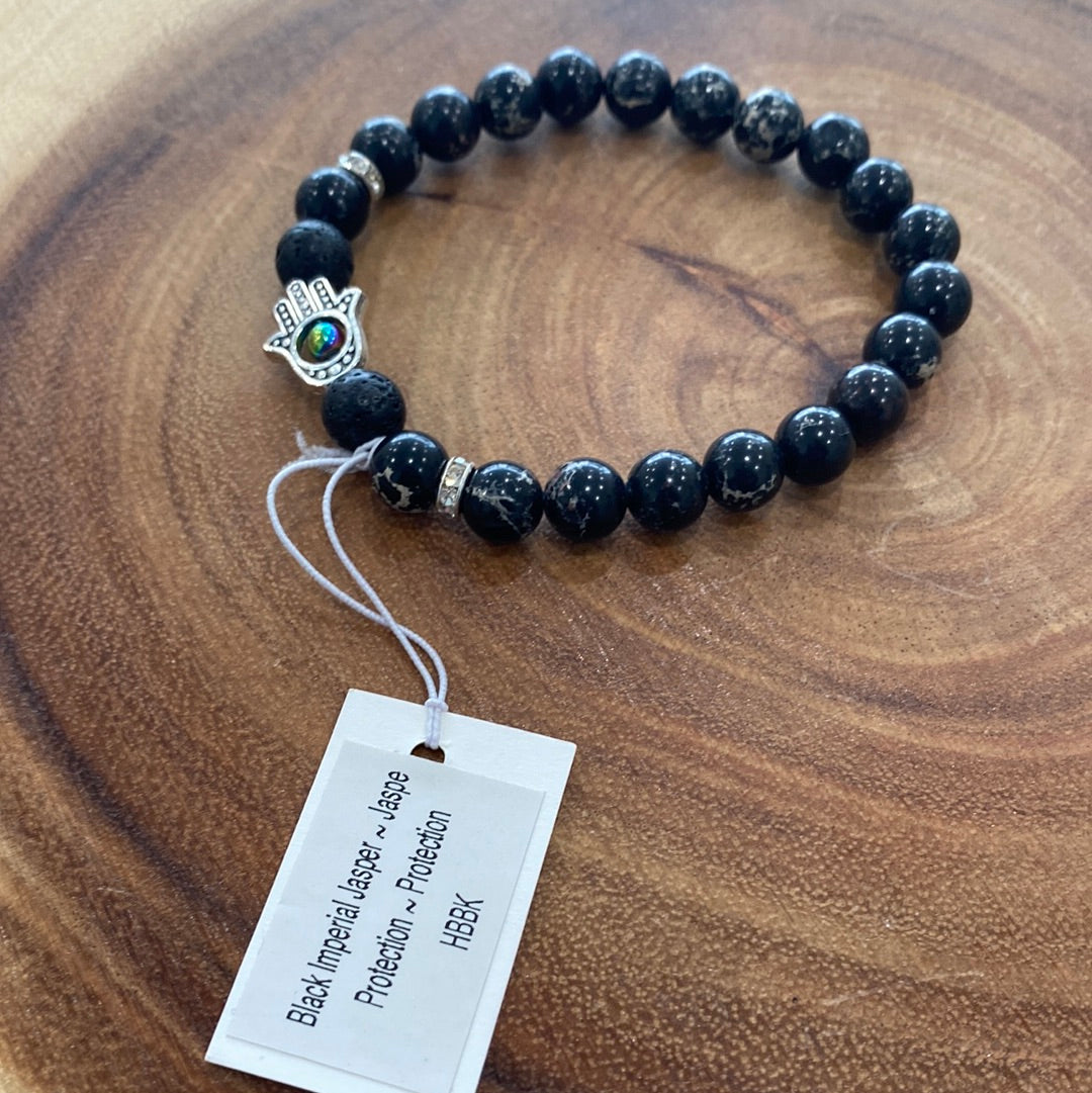 Black Imperial Jasper Hasma Bracelet featuring black jasper beads, symbolizing strength and vitality, elegantly crafted for spiritual enhancement.