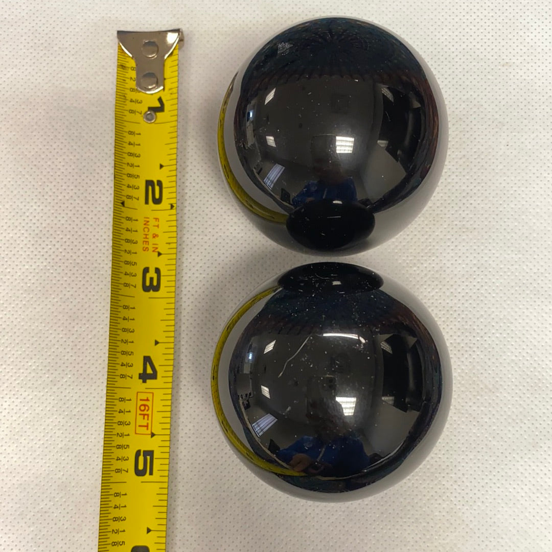 A polished Black Obsidian Sphere, approximately 2.5-3 inches in diameter, showcasing its unique glossy surface and deep black color.