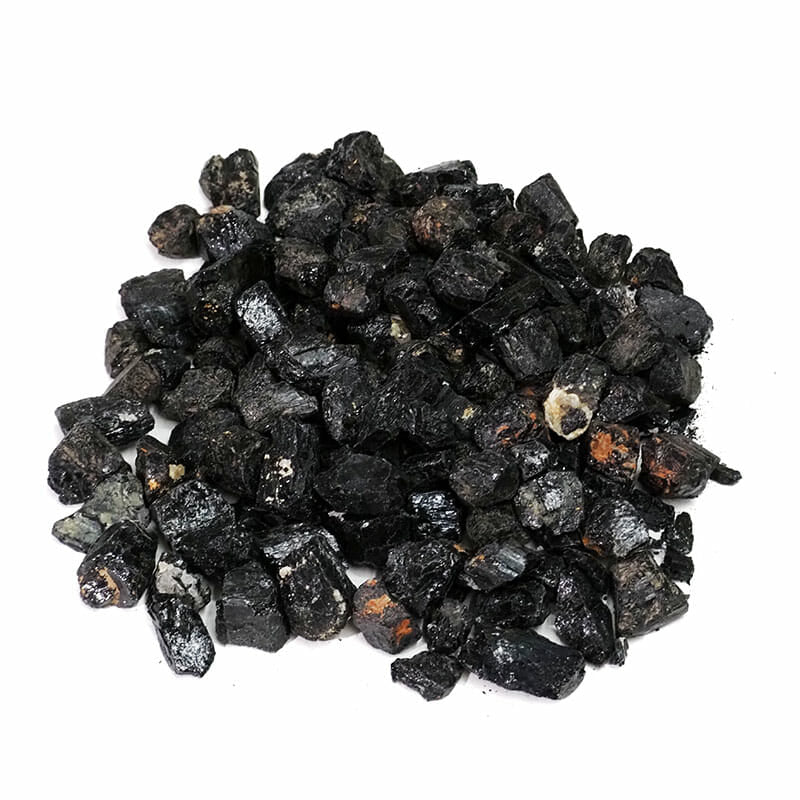 Raw chunks of Black Tourmaline showcasing their natural texture and deep black color, perfect for protection and grounding.