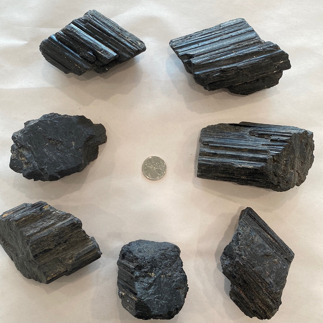 A collection of unique Black Tourmaline Rough Cut Small stones, showcasing their natural beauty with Mica and Quartz inclusions.