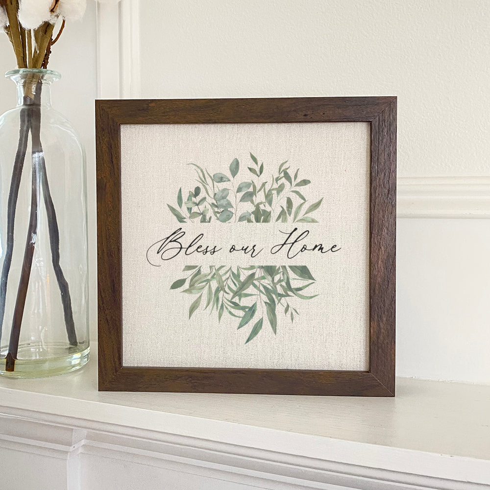 Bless Our Home Greenery framed sign with a wood frame and linen-look background, perfect for home decor.